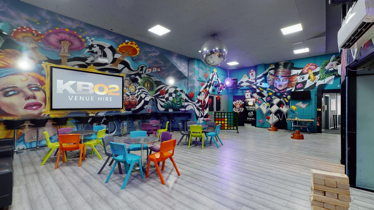 Vibrant event space with colorful furniture, ideal for team-building and gatherings.