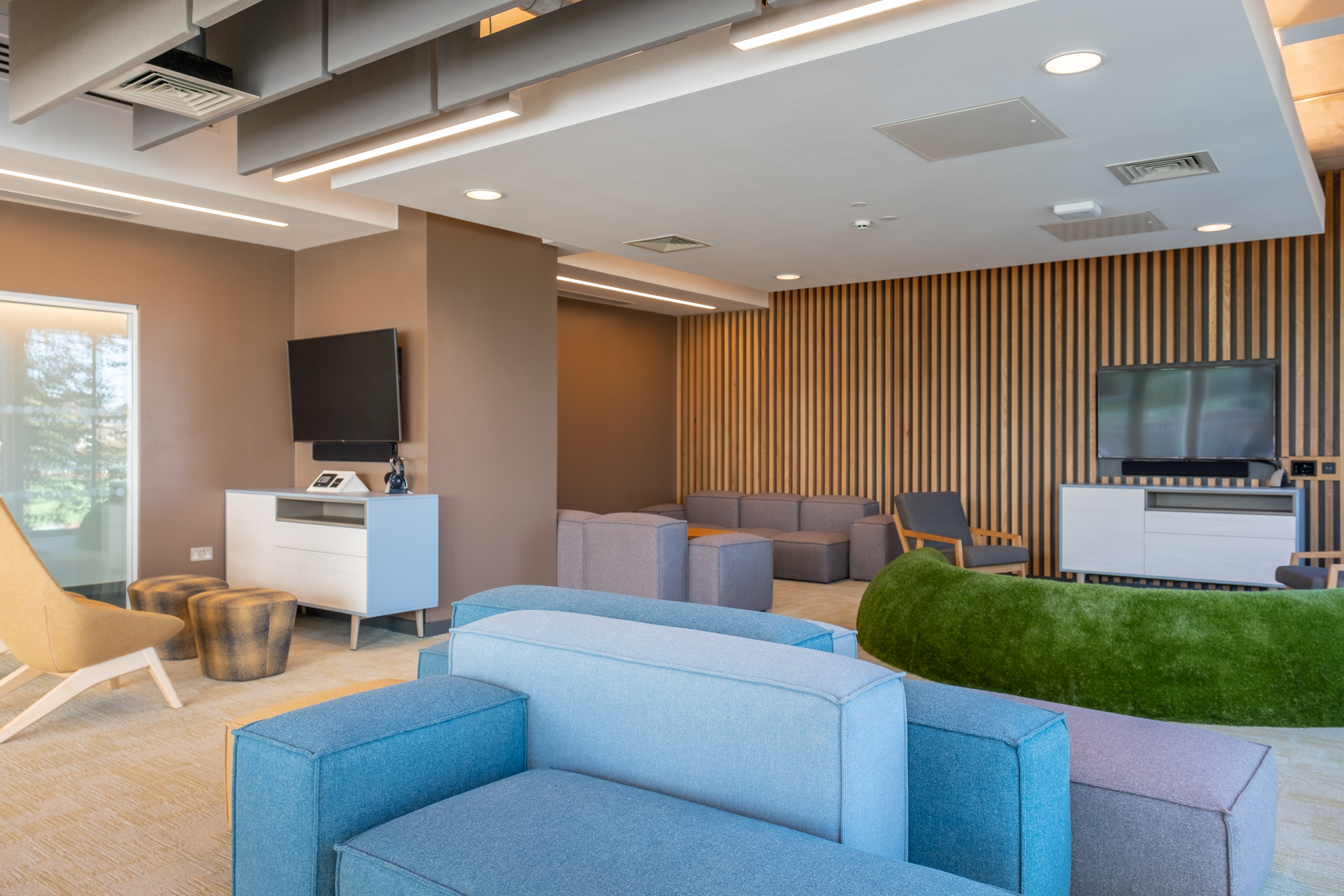 Modern seminar room with comfortable seating for networking and informal meetings.