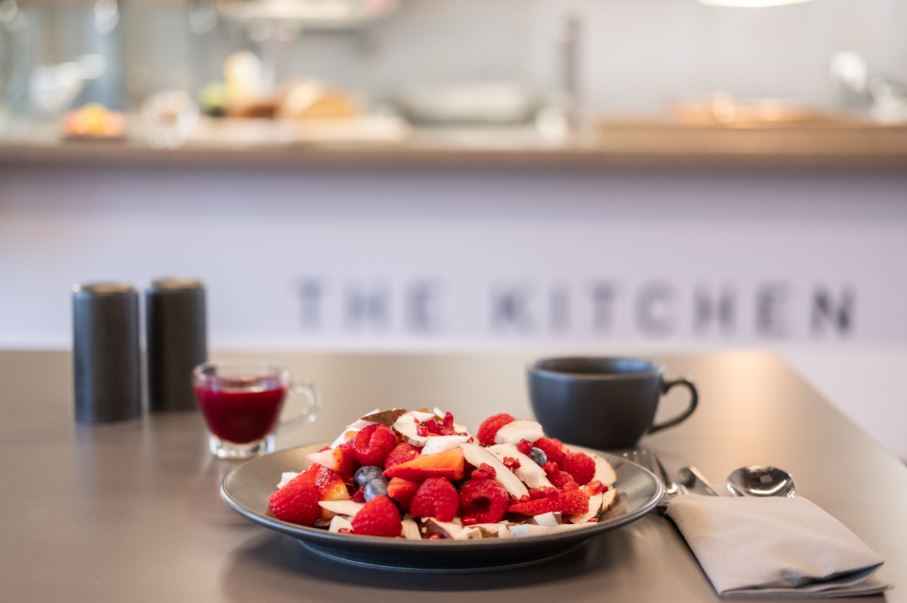 Breakfast plate with fresh fruits in seminar room at Elite Athlete Centre. Networking event.