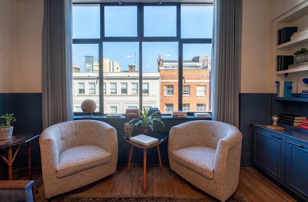 Cozy meeting space in Mortimer House with natural light, perfect for brainstorming sessions.