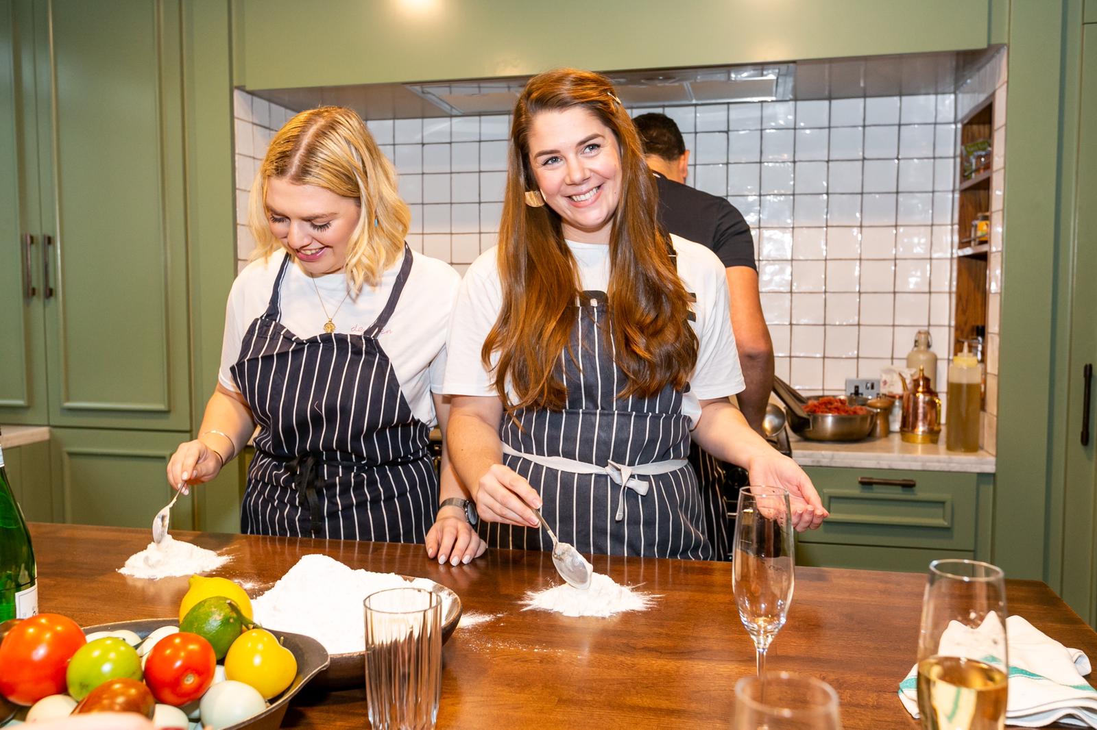 Team-building cooking event at Mortimer House with a stylish kitchen backdrop.