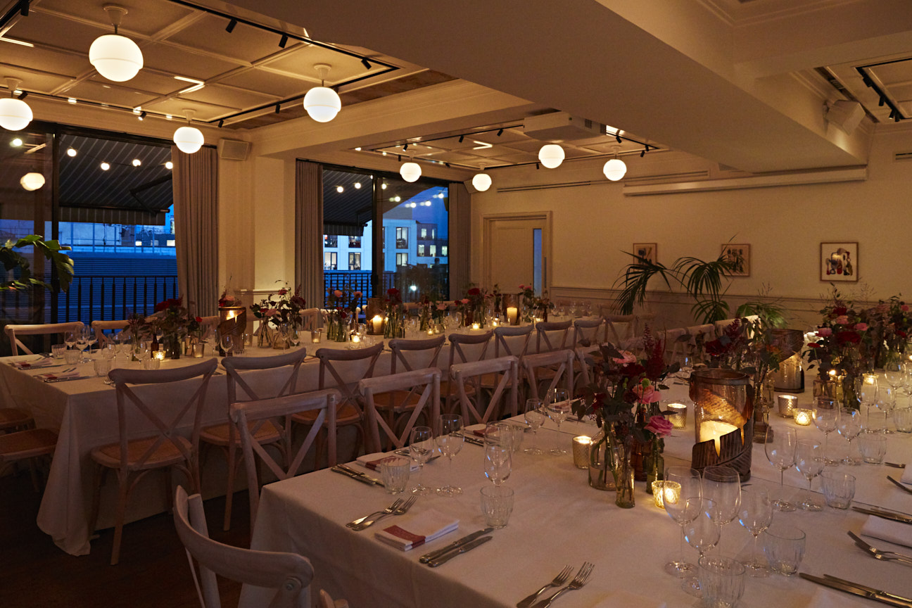 Elegant event space with floral centerpieces for intimate dinners and gatherings.