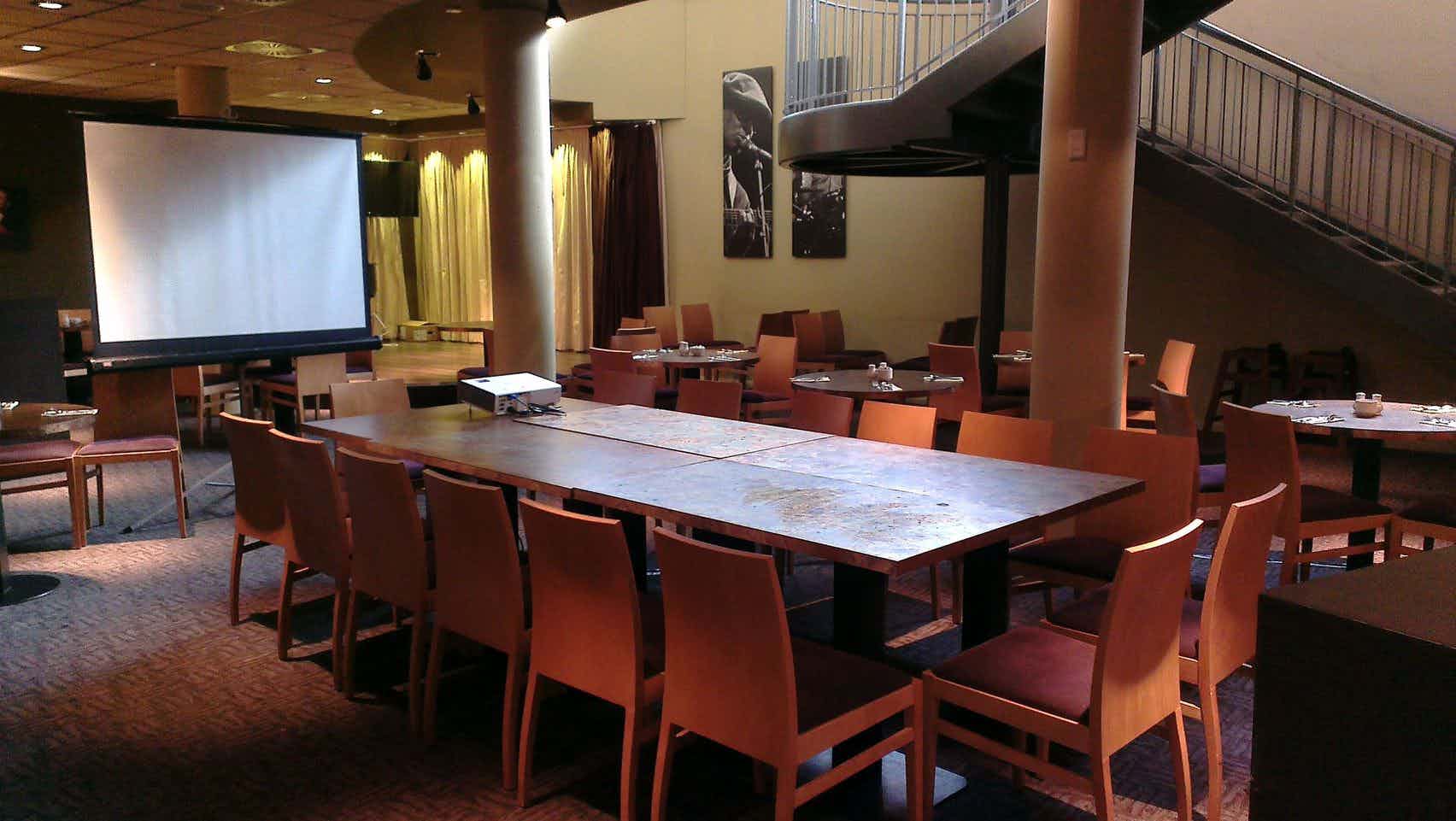 Jazz Club at Future Inn Bristol: versatile meeting space with projector and inviting decor.