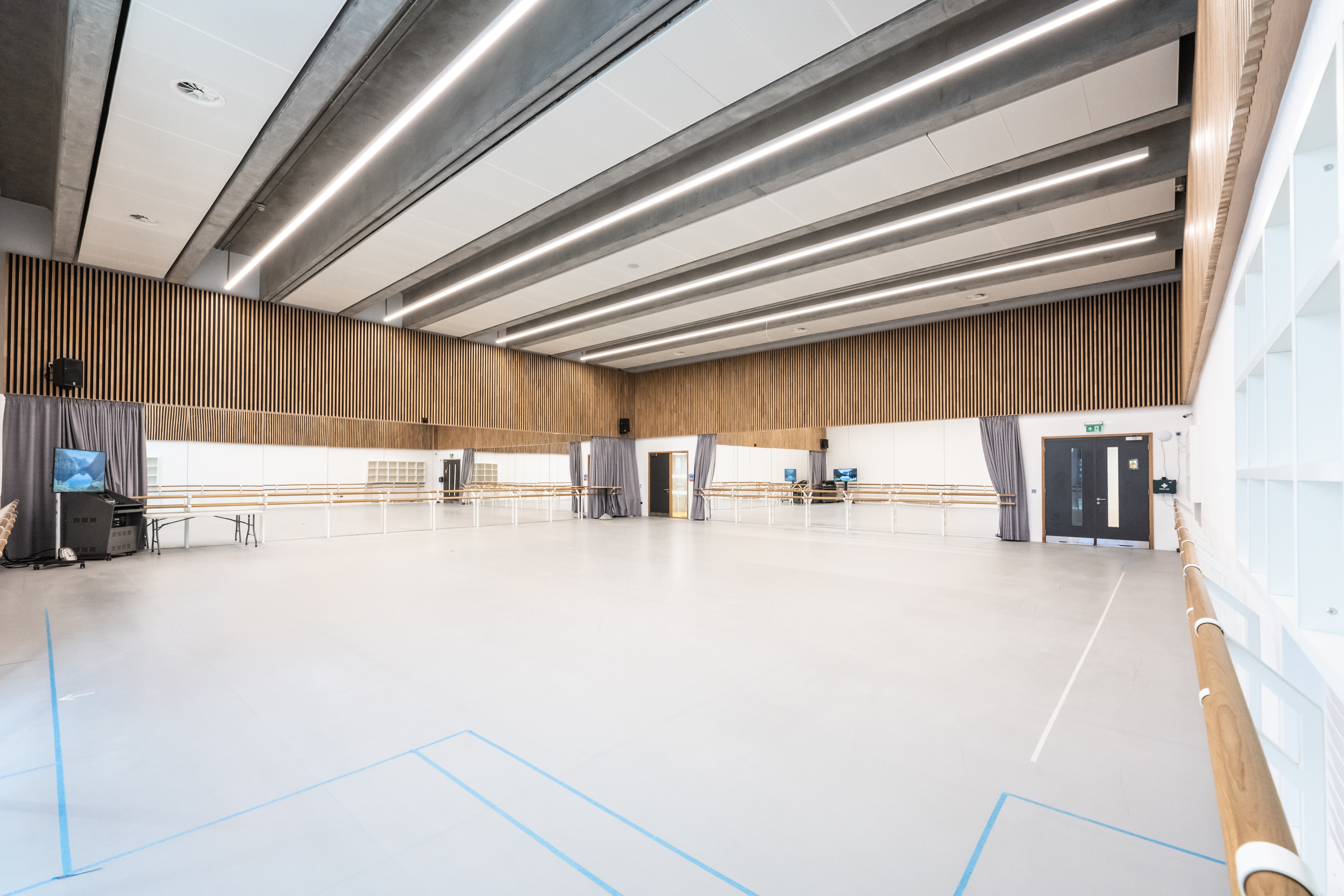 Spacious rehearsal studio with mirrors for dance classes and workshops in London.