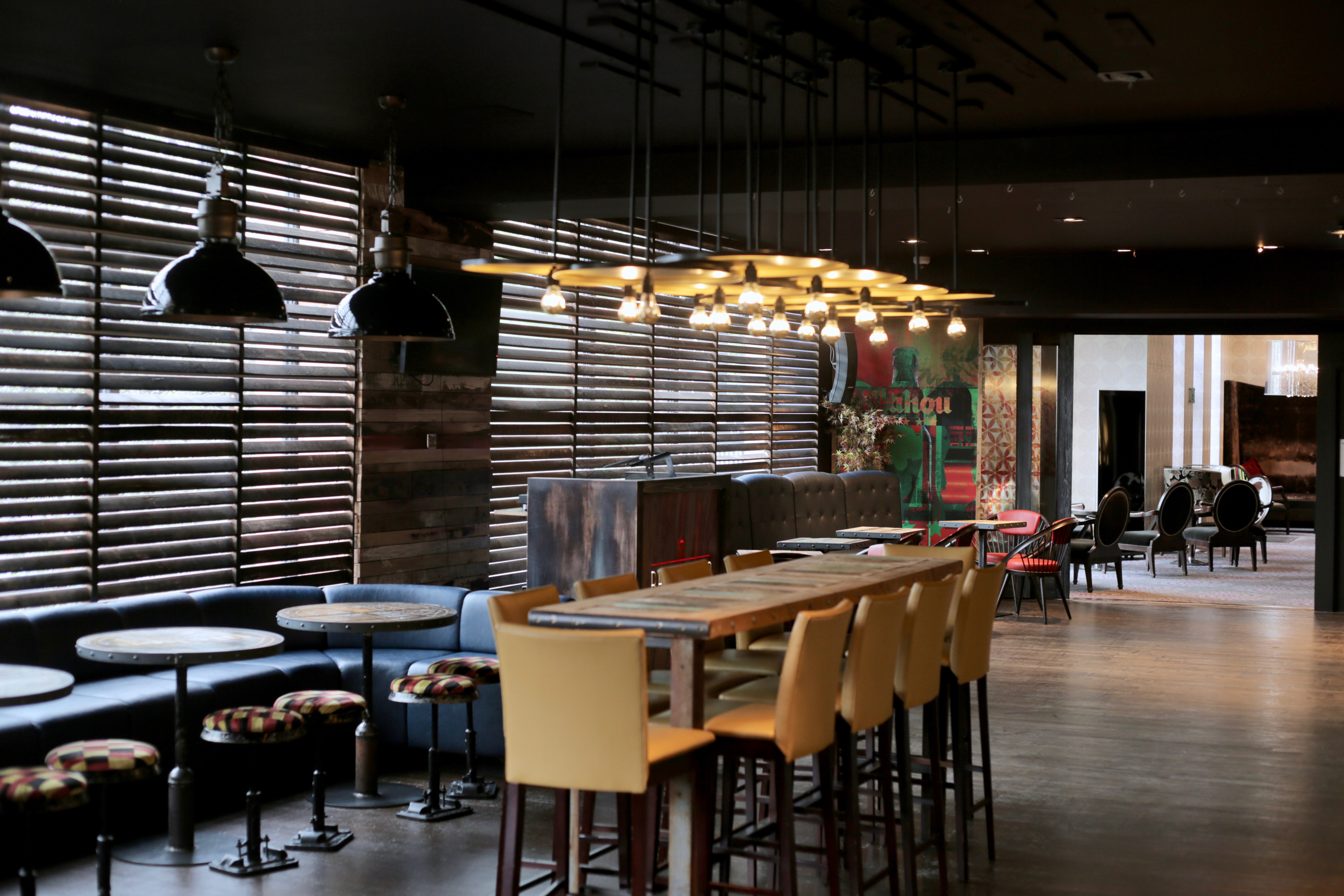 Modern Bar Esquina at Alea Casino, ideal for events with cozy booths and natural light.