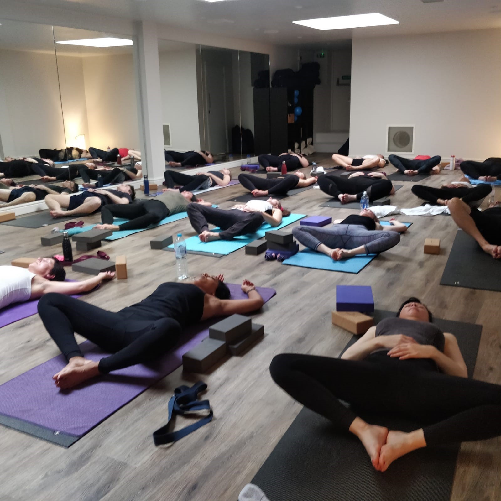 Serene yoga session at Yoga Rocks studio, promoting wellness and mindfulness events.