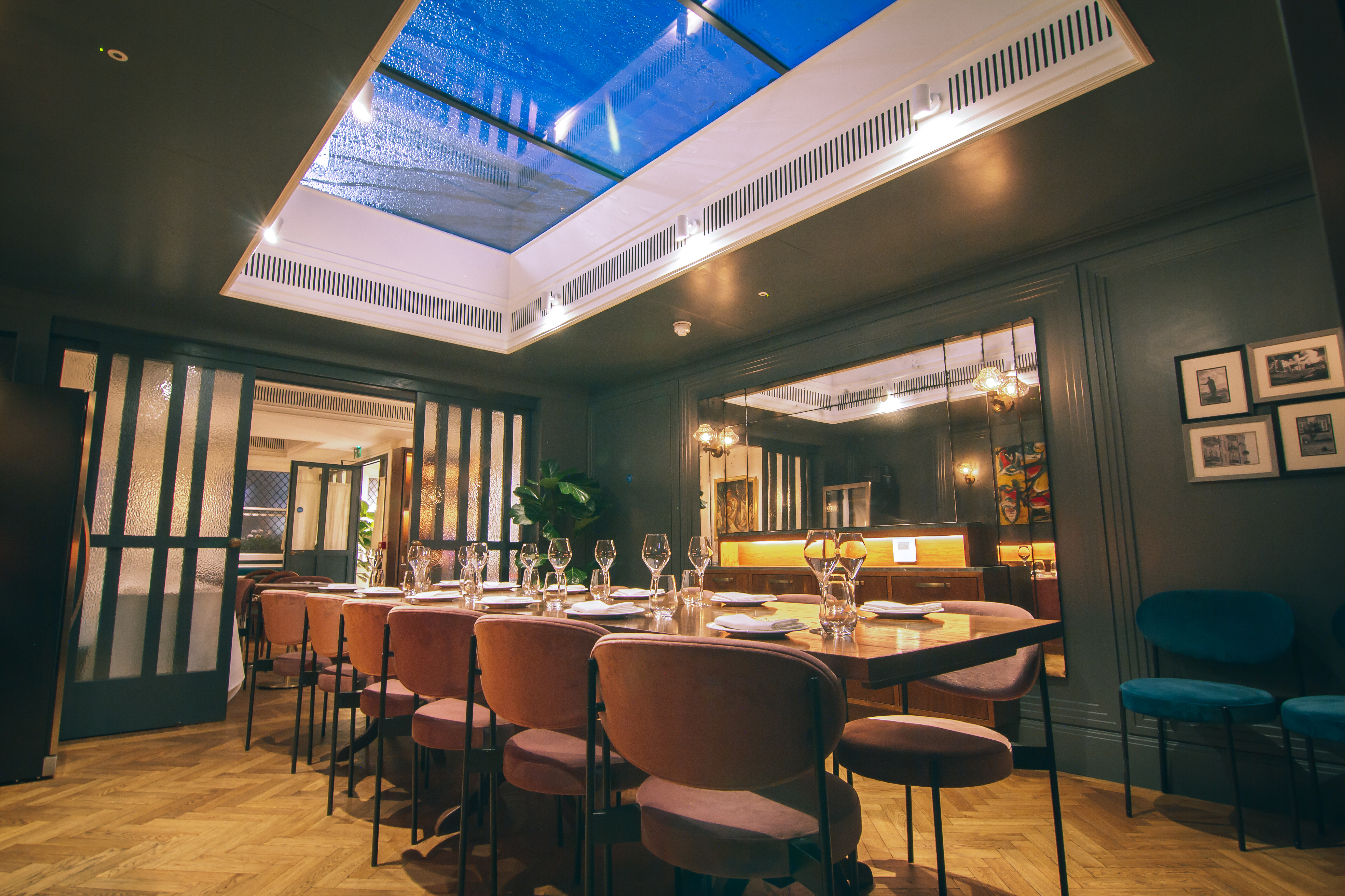 Stylish meeting space with long table, ideal for corporate events and private gatherings.