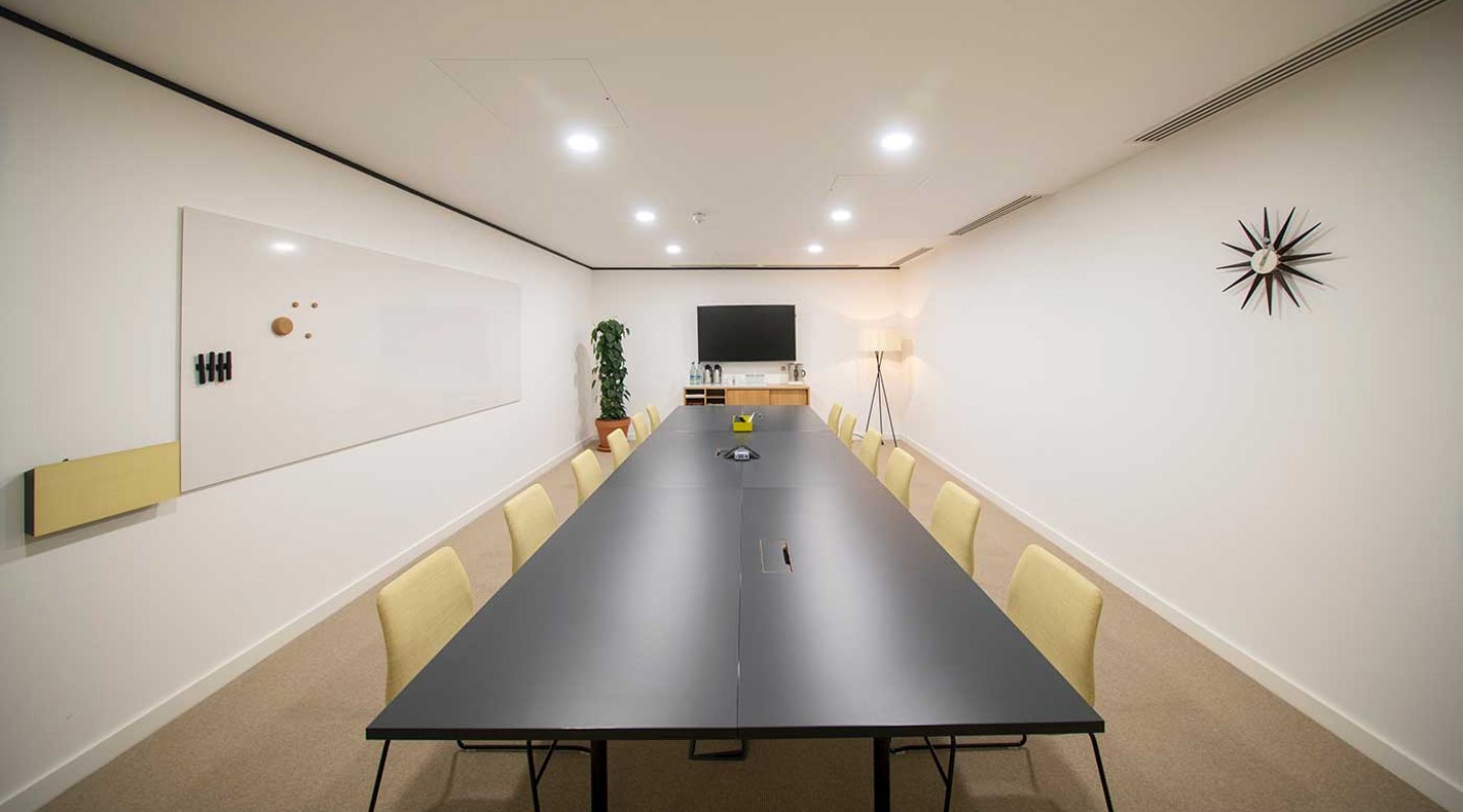 Modern meeting room with long table for collaboration at Spaces Covent Garden.