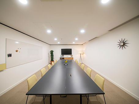 Modern conference room with long table for meetings and events at Spaces Covent Garden.