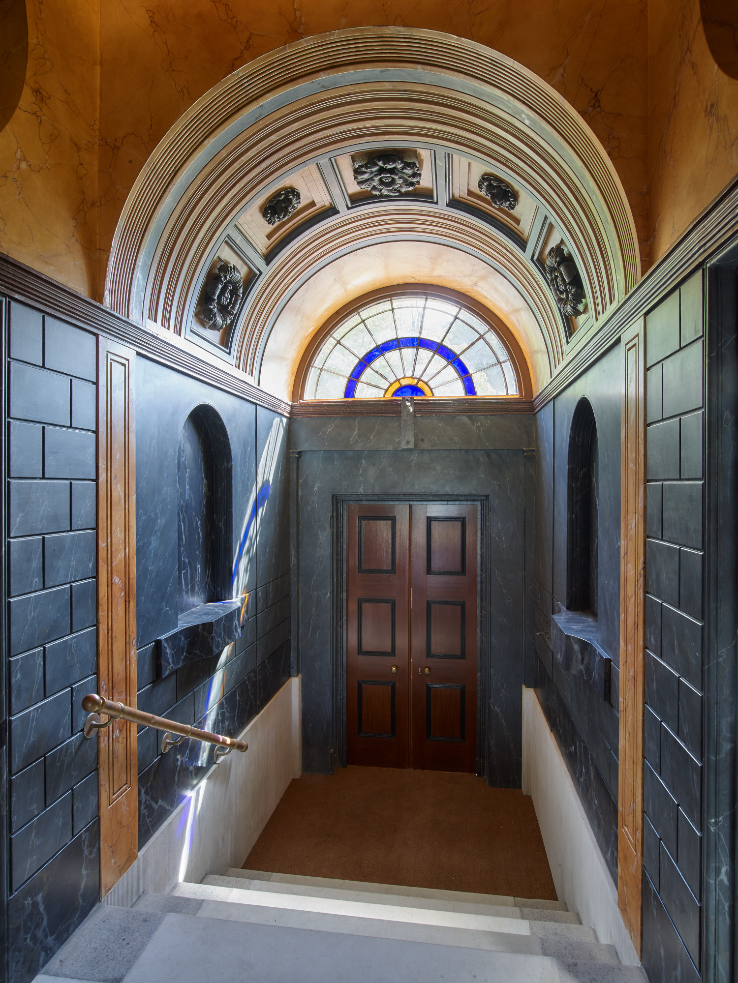 Elegant entrance of Soane Suite with stained glass, perfect for upscale events.