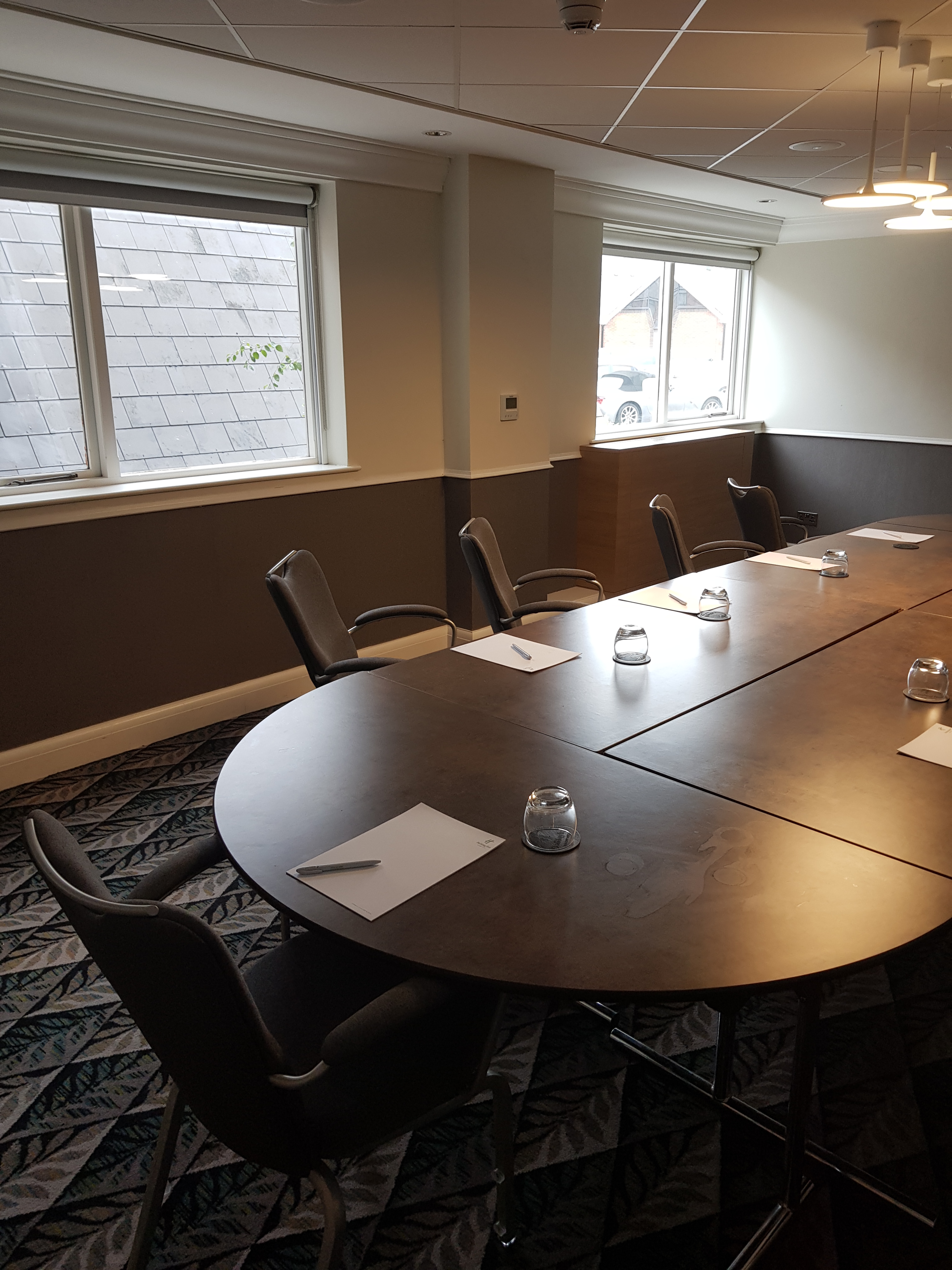 Leicester Suite meeting room with oval table, perfect for corporate events and workshops.