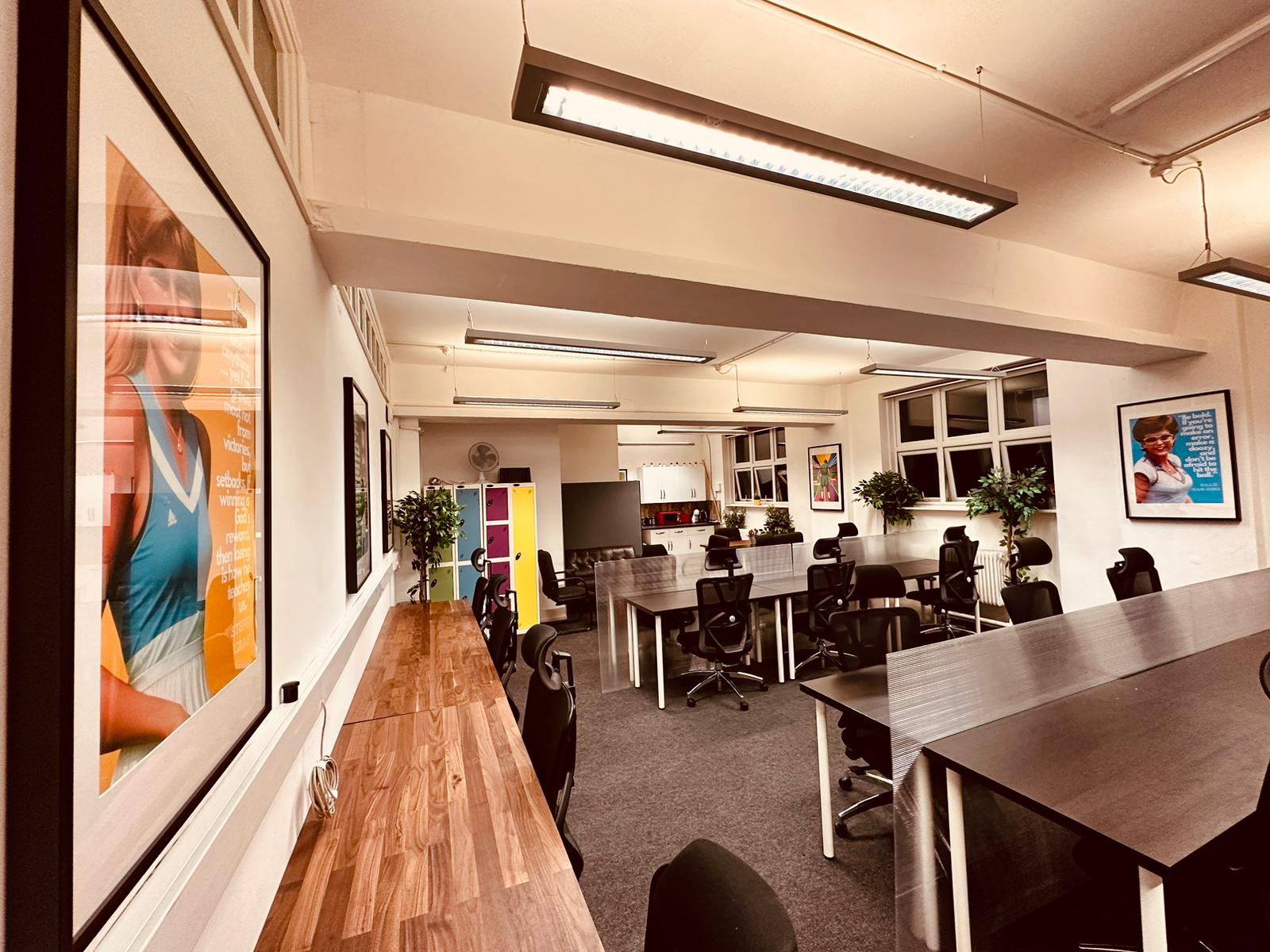 Modern meeting space in Wimbletech with vibrant artwork, ideal for workshops and brainstorming.