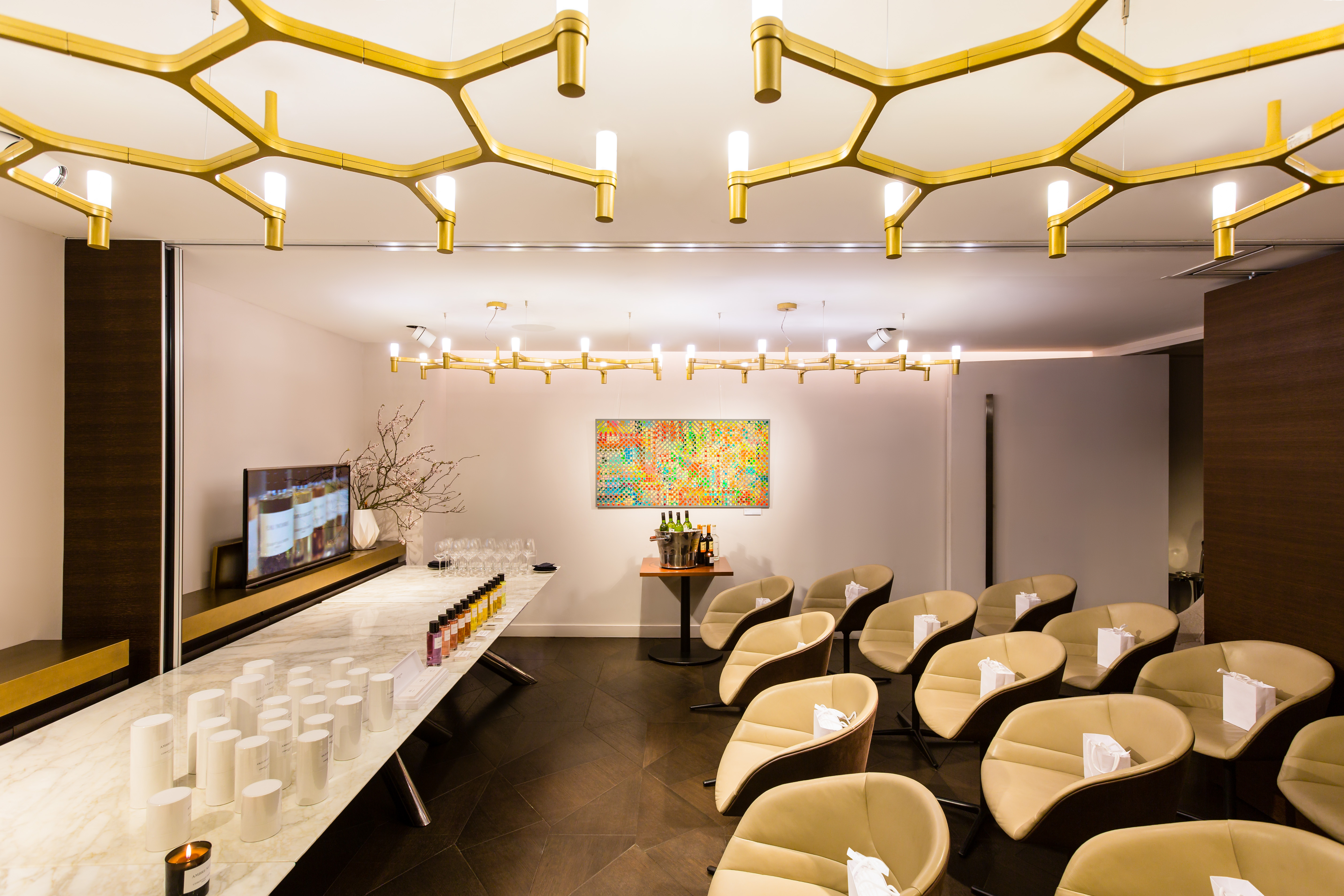 Modern meeting space at The Libraries with honeycomb lights, ideal for corporate events.