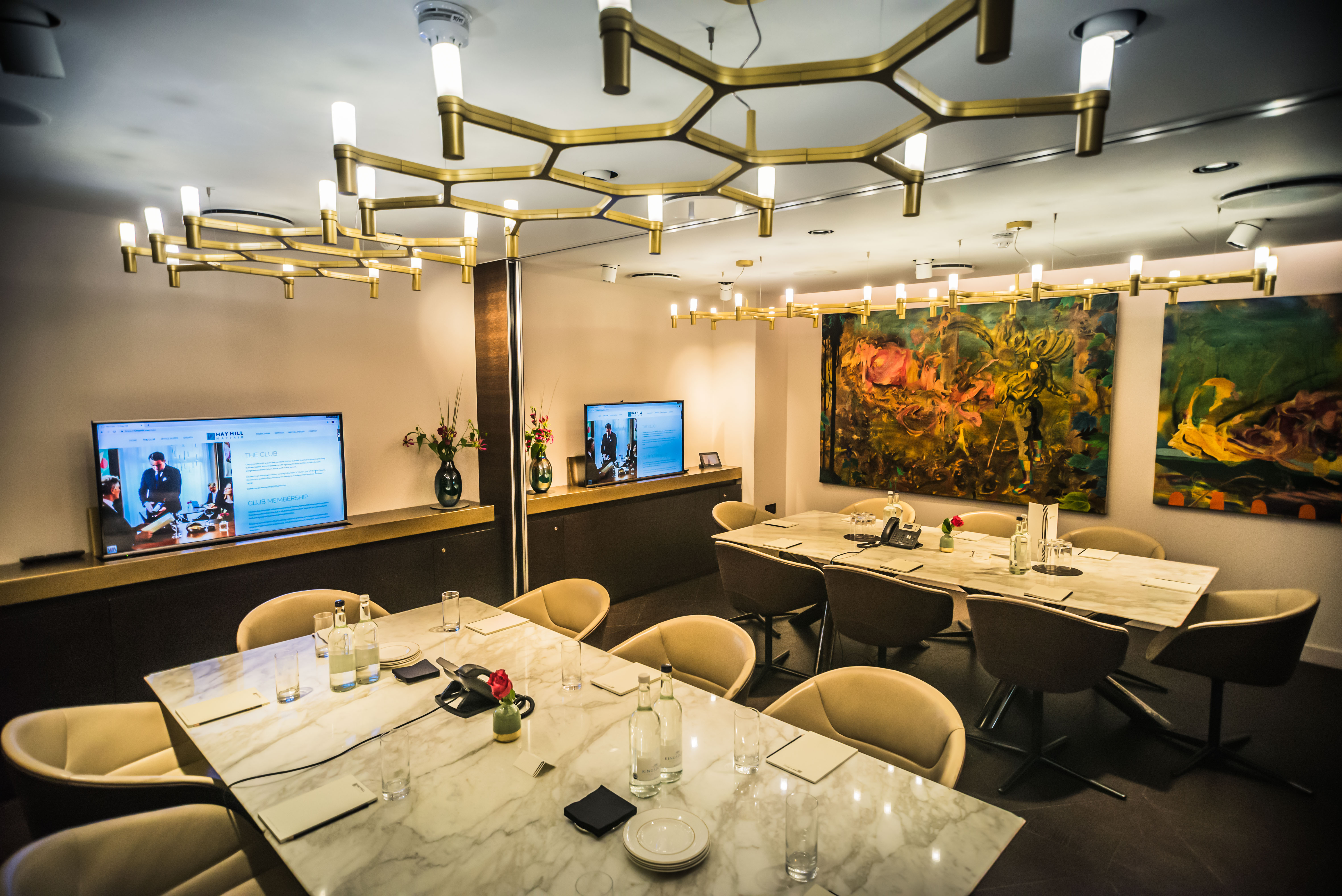 Modern meeting room at The Libraries with marble table, ideal for corporate events.