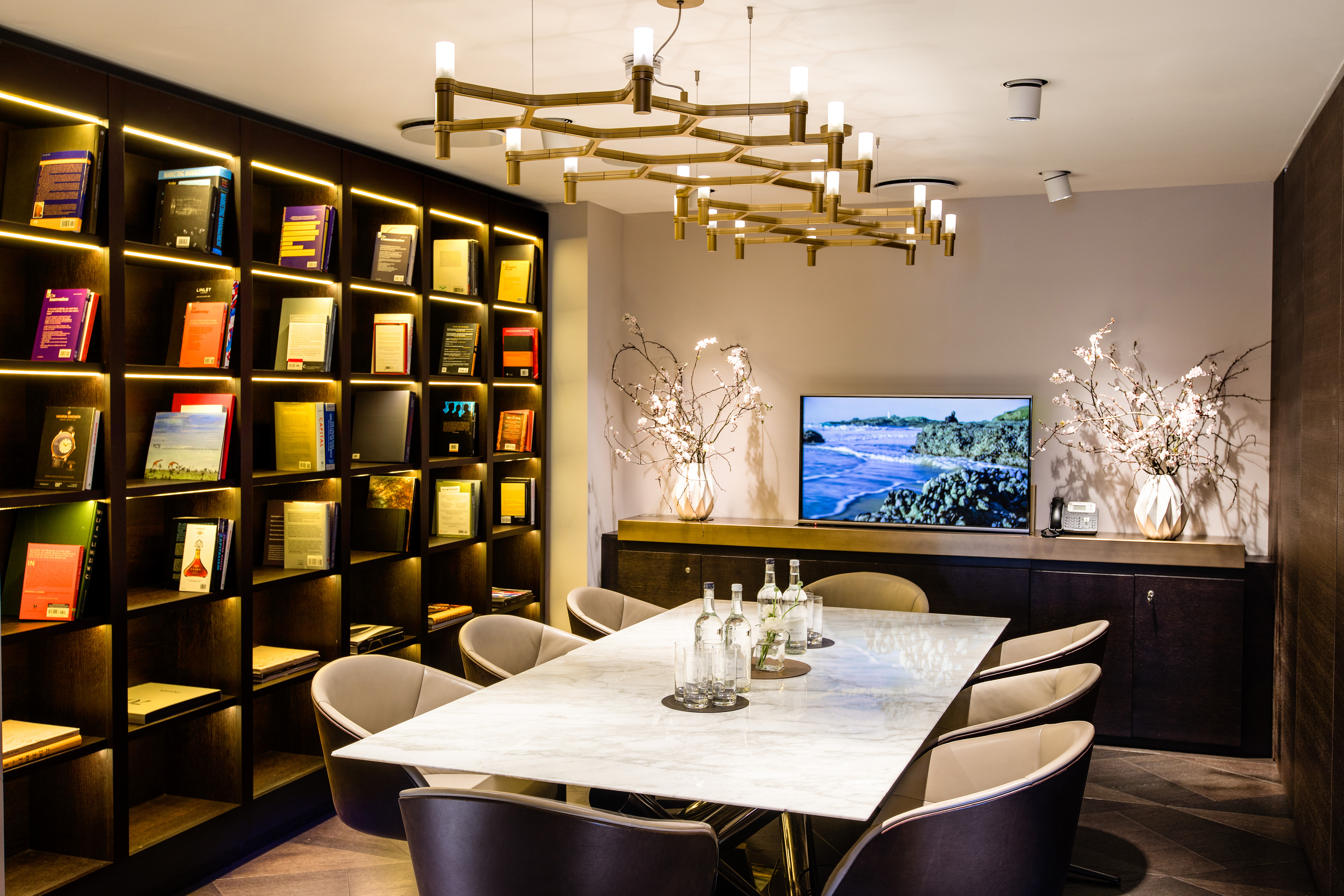 Modern meeting room at The Libraries, featuring a marble table for intimate gatherings.