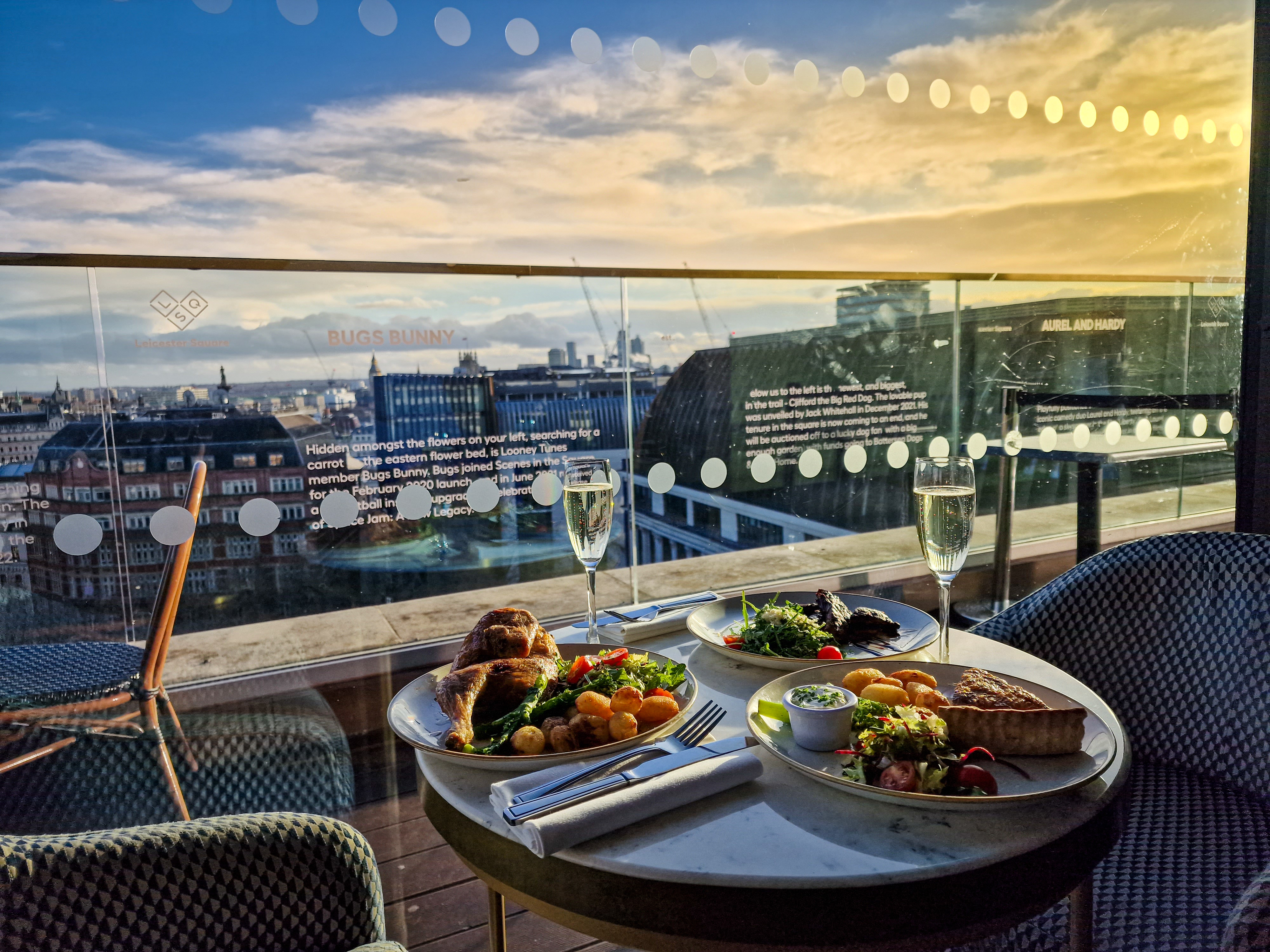 Elegant rooftop dining with gourmet food and city view for upscale events.