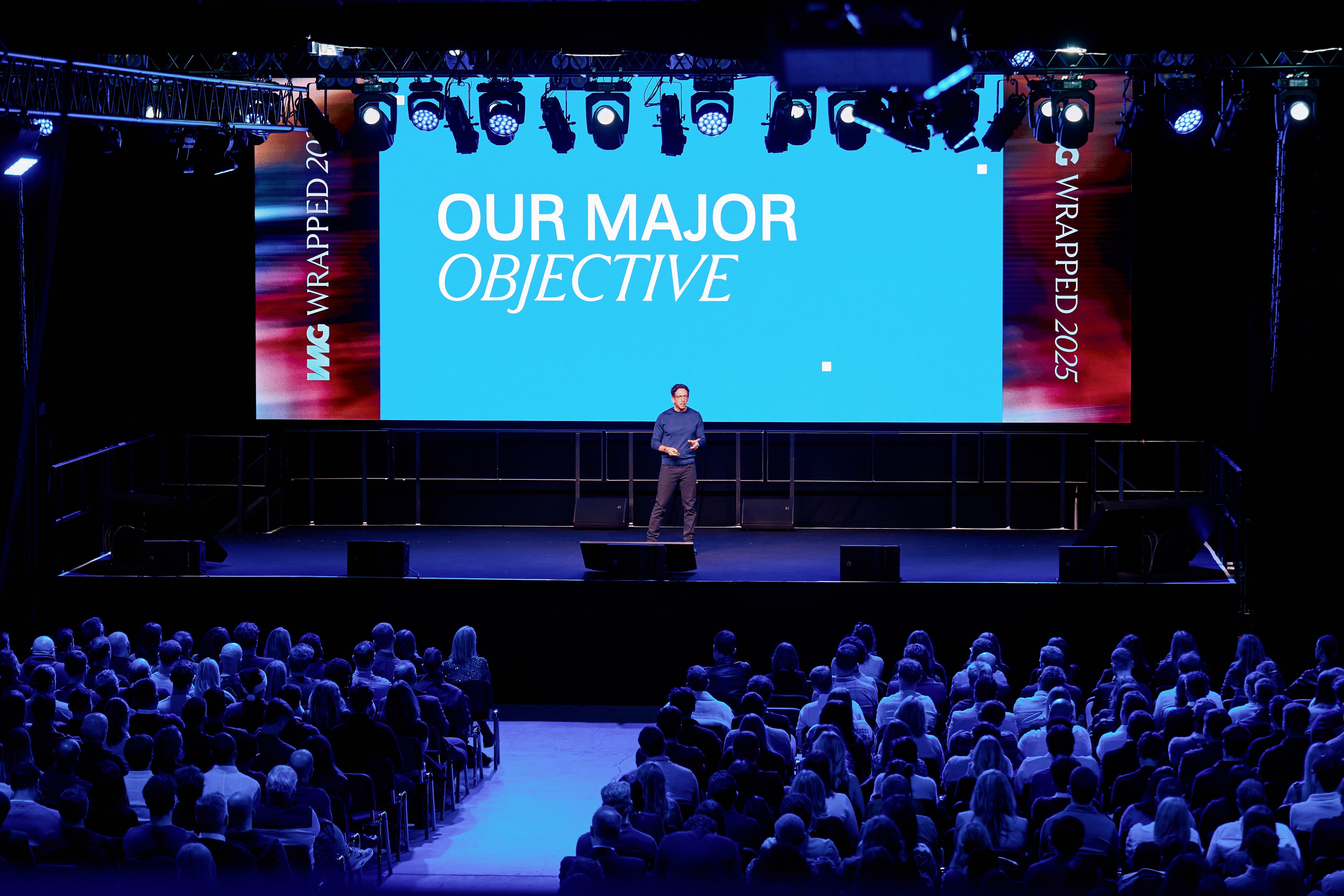 Corporate keynote stage at Exhibition White City with LED wall for professional business events.