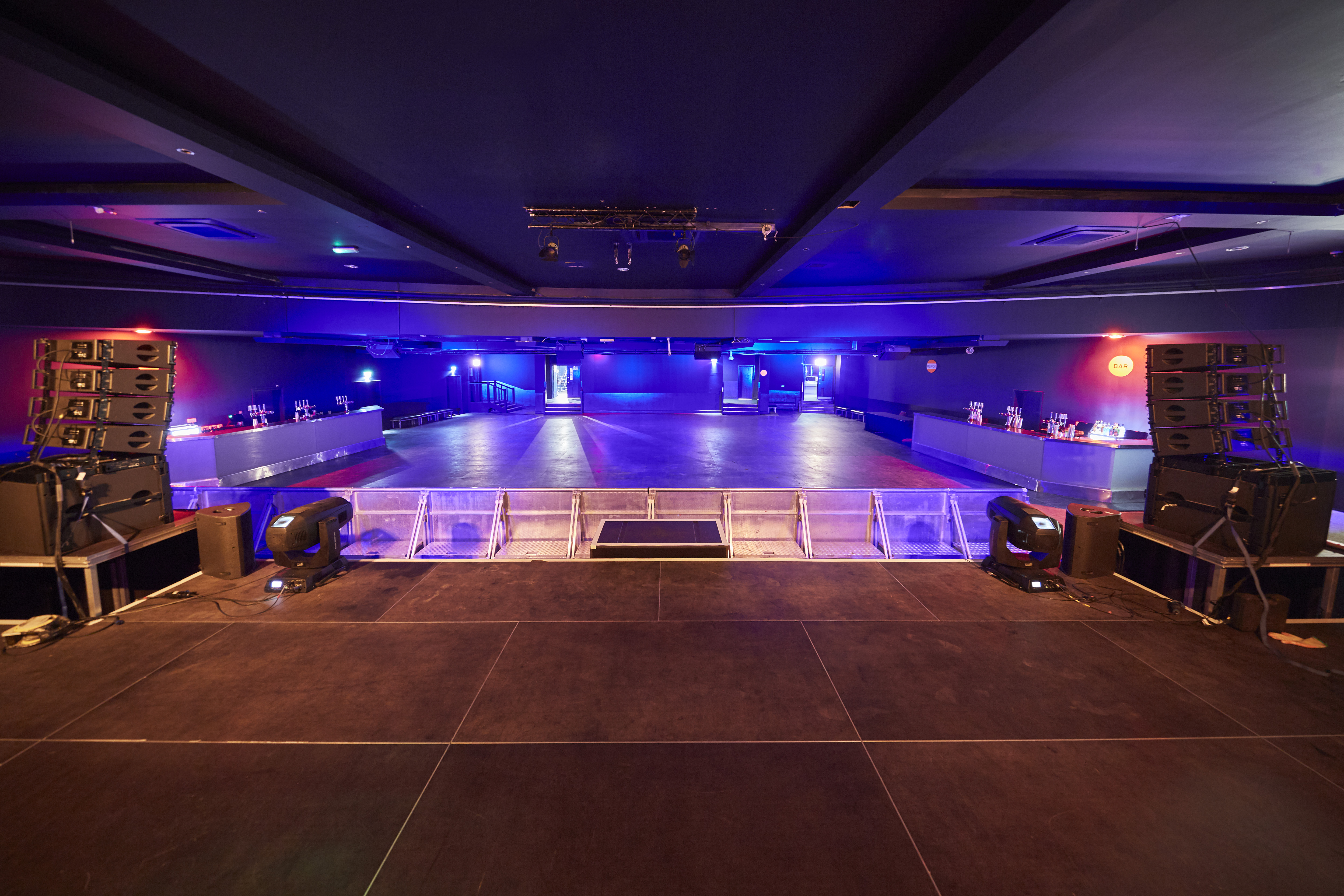 Versatile Concert Hall with spacious dance floor for events and performances.