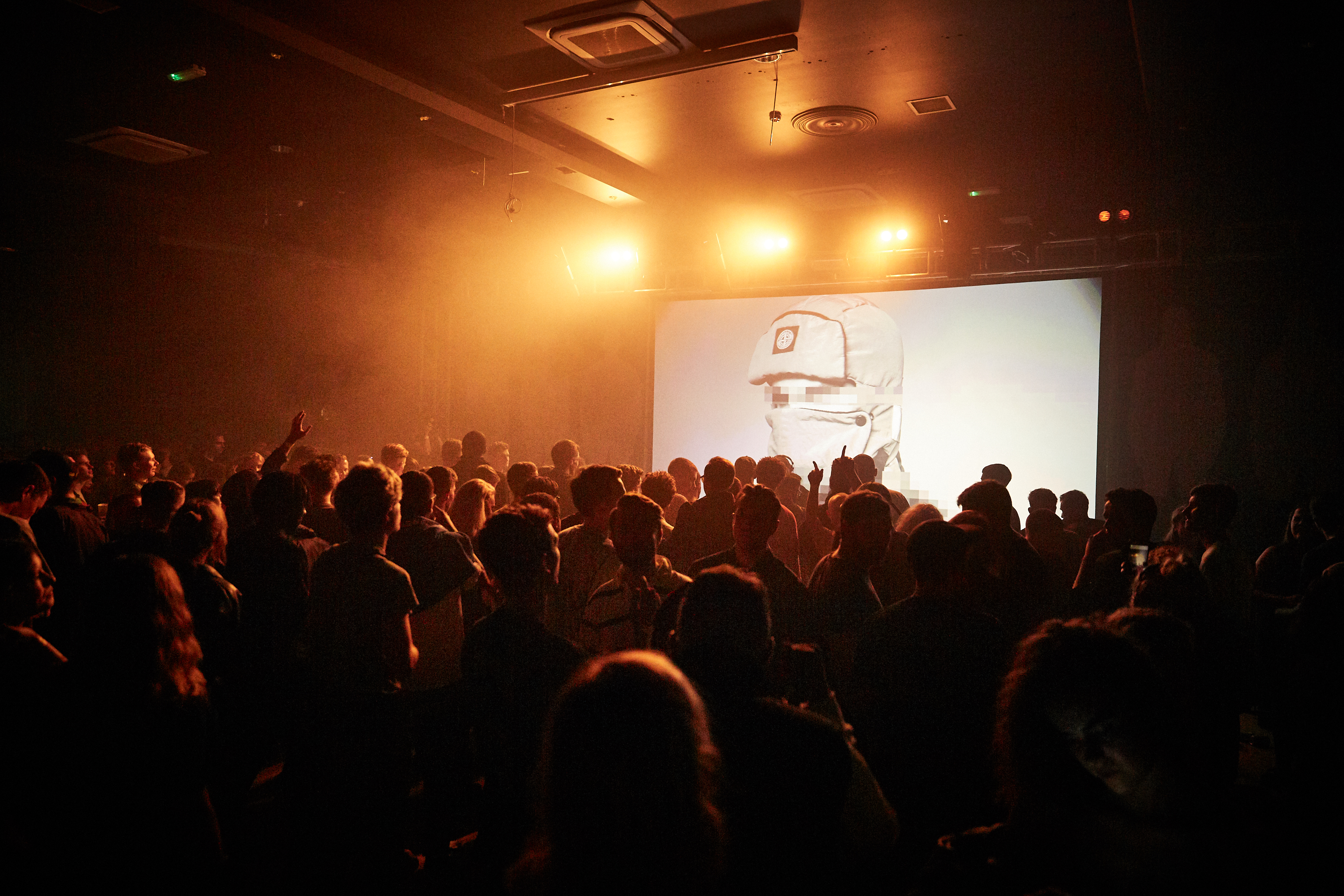 Vibrant Concert Hall event with dramatic lighting and large crowd engagement.