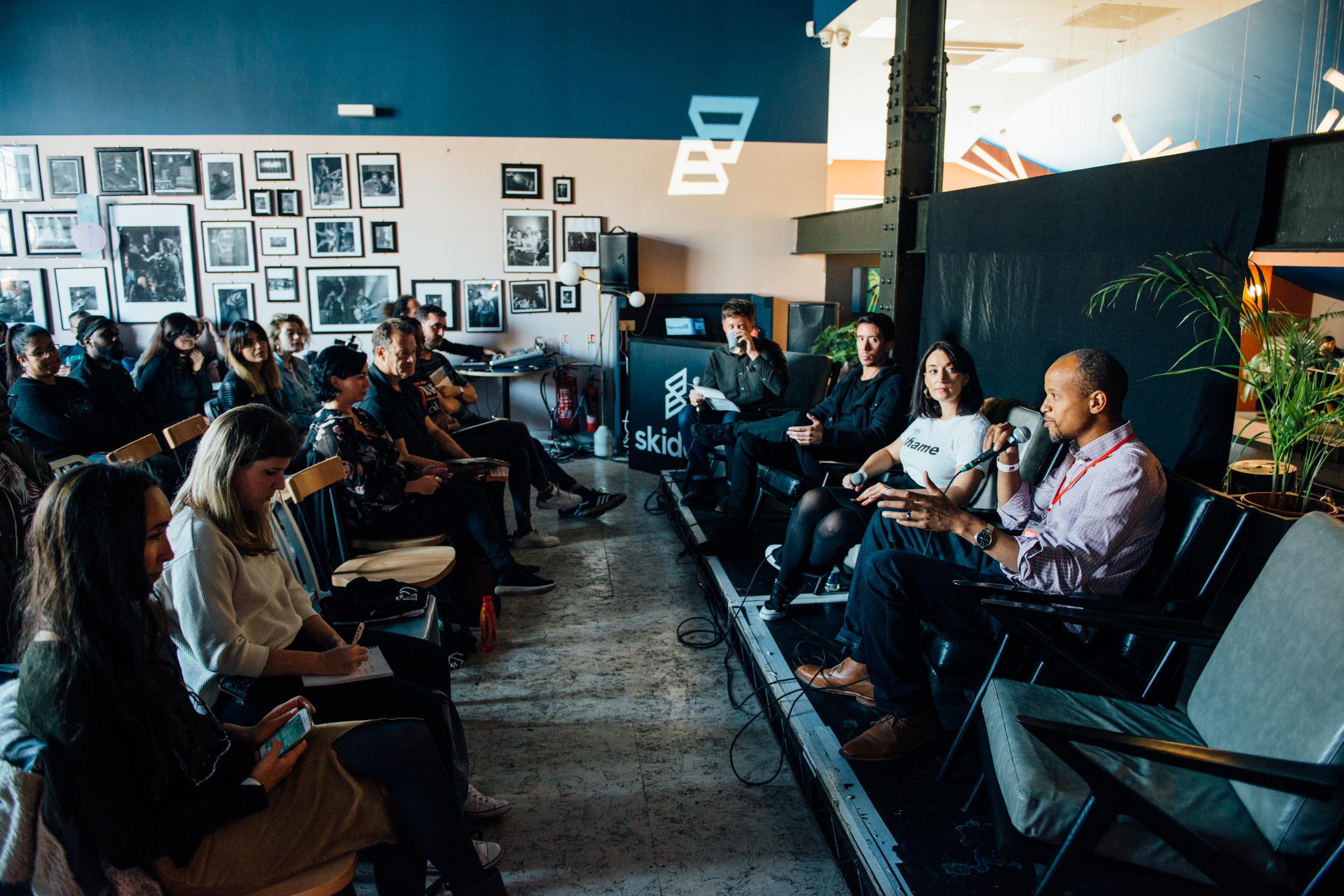 Panel discussion at Bar + Kitchen in EartH, featuring casual networking and collaboration.
