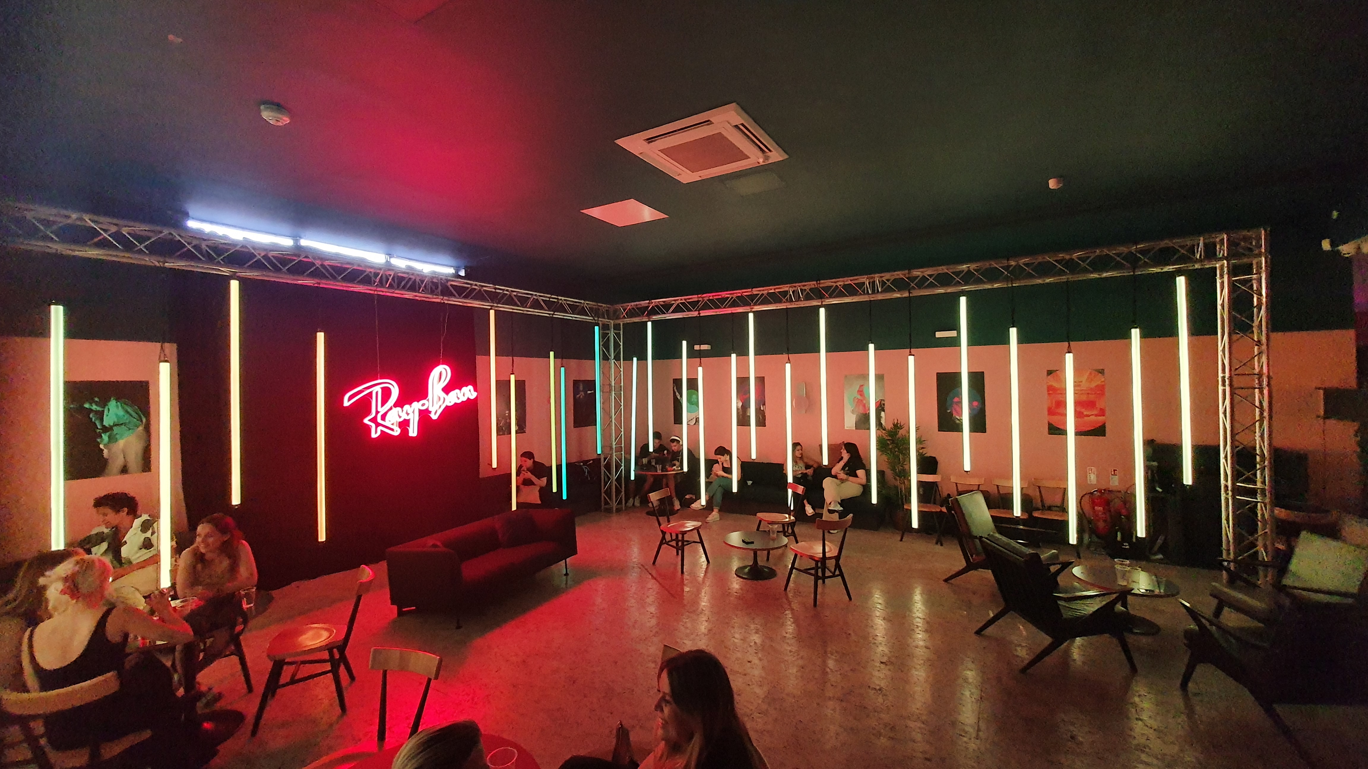 Stylish event space at Bar + Kitchen, modern decor with neon lighting for gatherings.