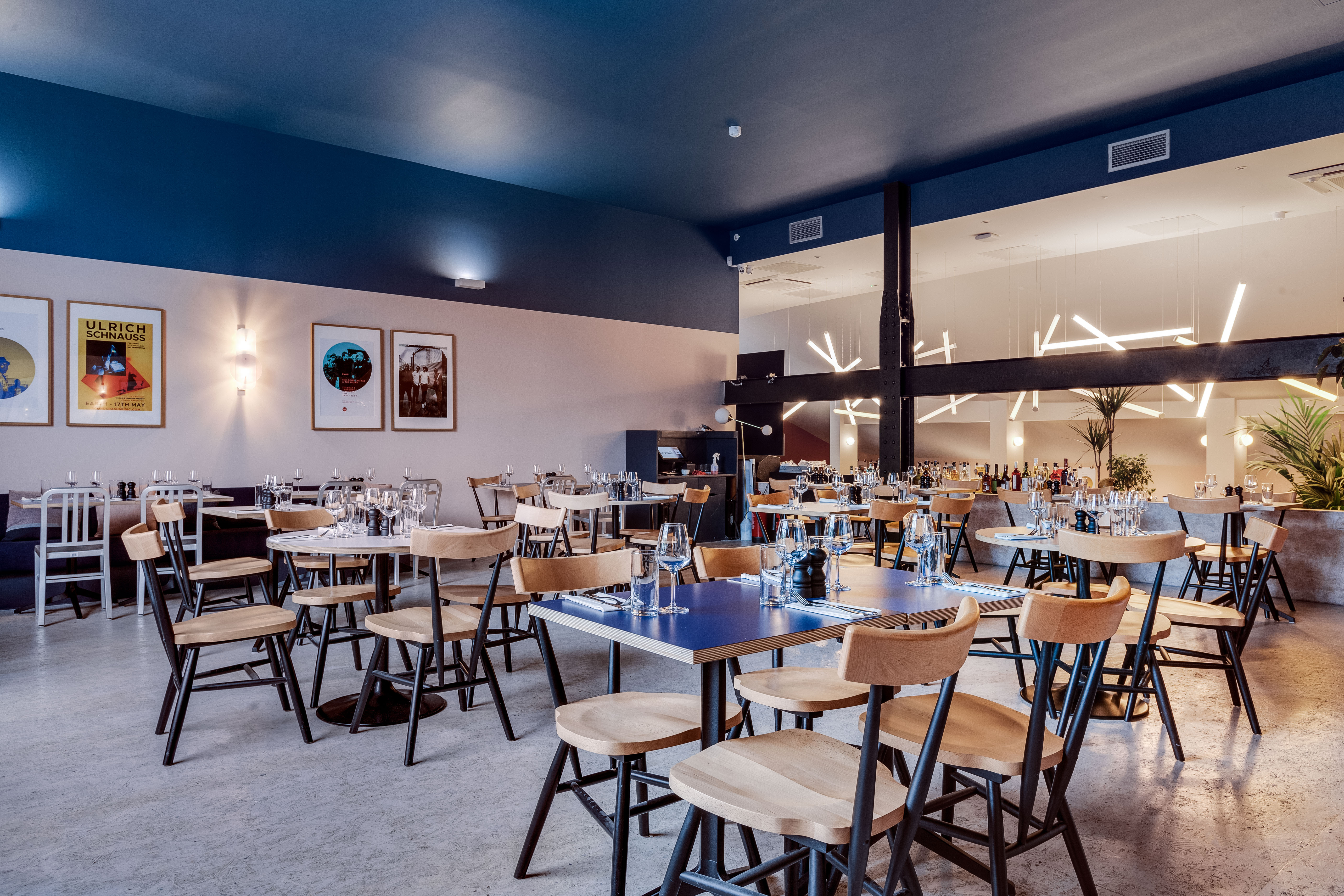 Modern restaurant Bar + Kitchen in EartH, ideal for events with flexible seating.