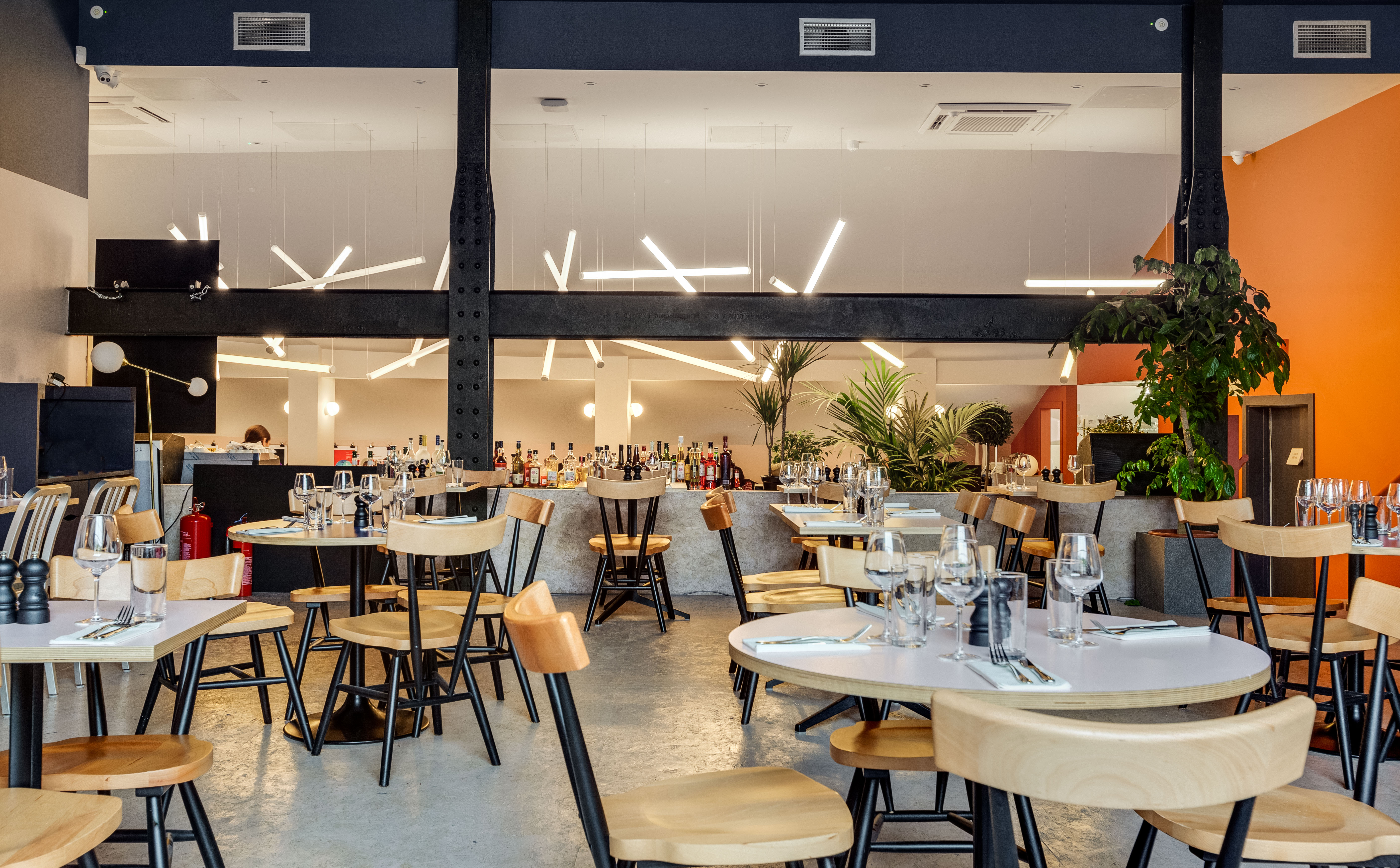 Modern dining space at Bar + Kitchen, ideal for events and gatherings.