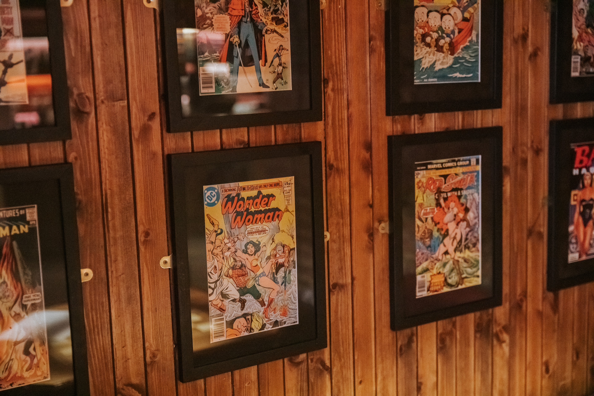Vibrant comic book wall at Flatmates Den, ideal for themed events and gatherings.