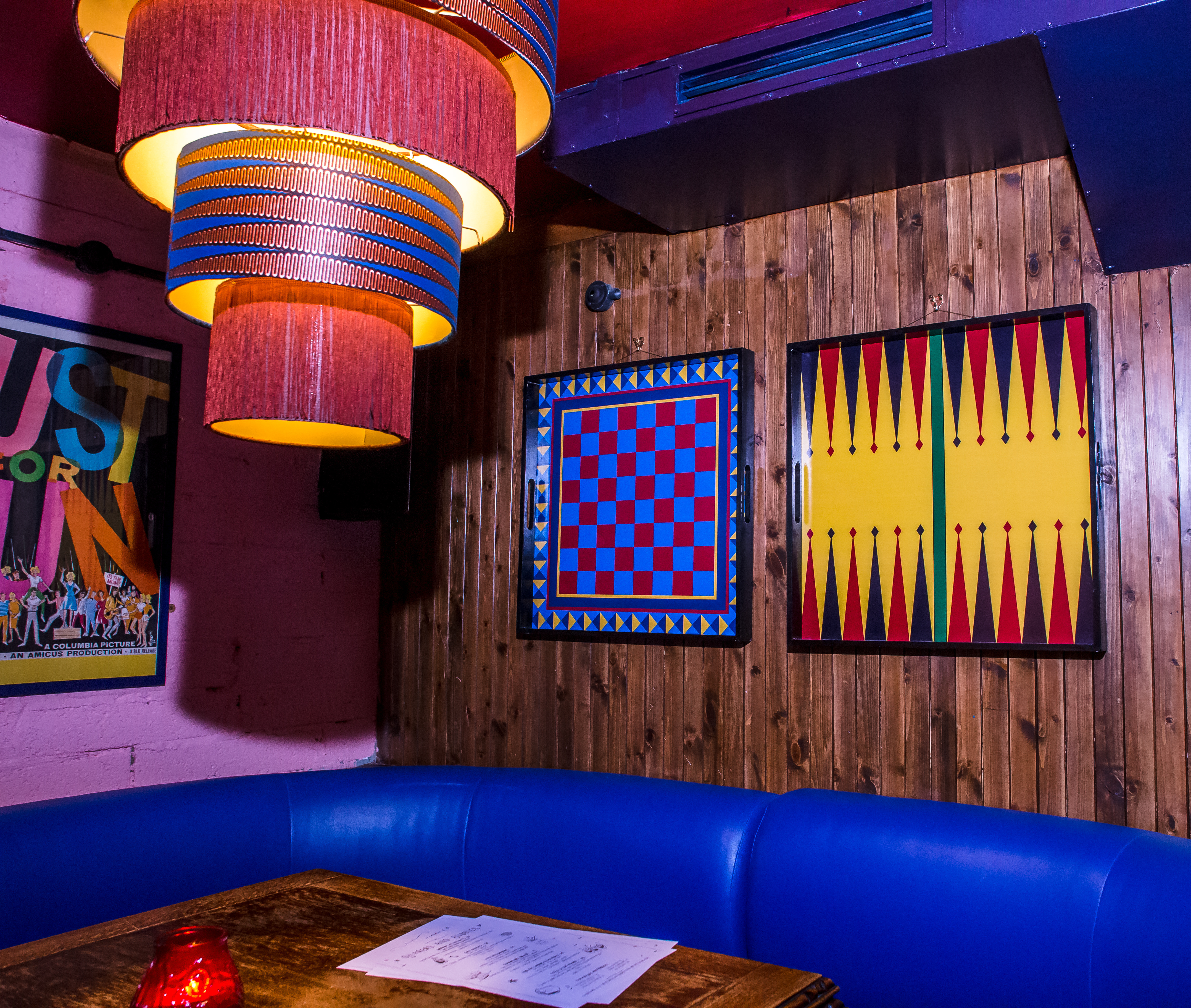 Vibrant event space at Flatmates Den with colorful decor for casual gatherings and networking.