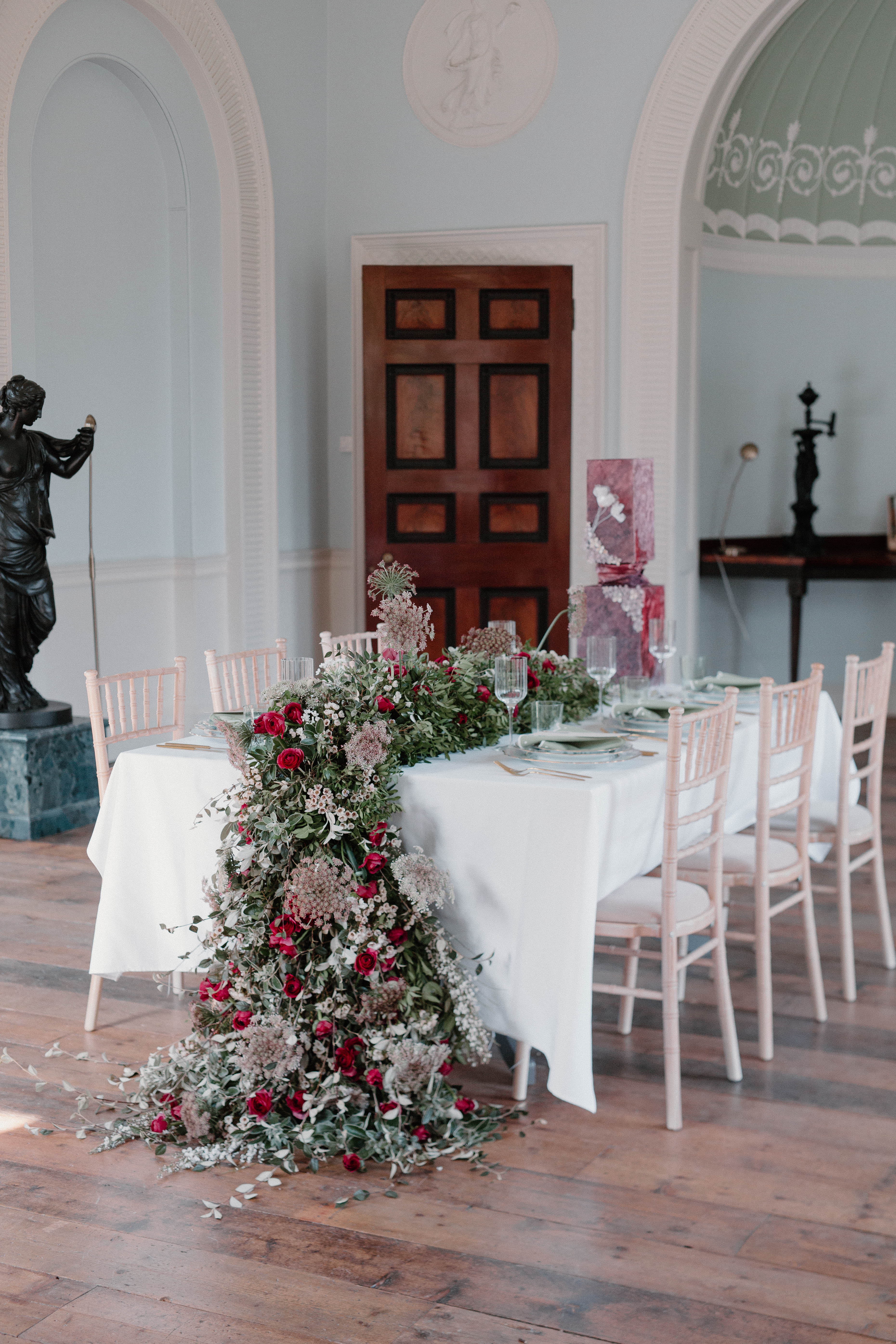 Elegant dining table with floral centerpiece at Pitzhanger Manor for events.