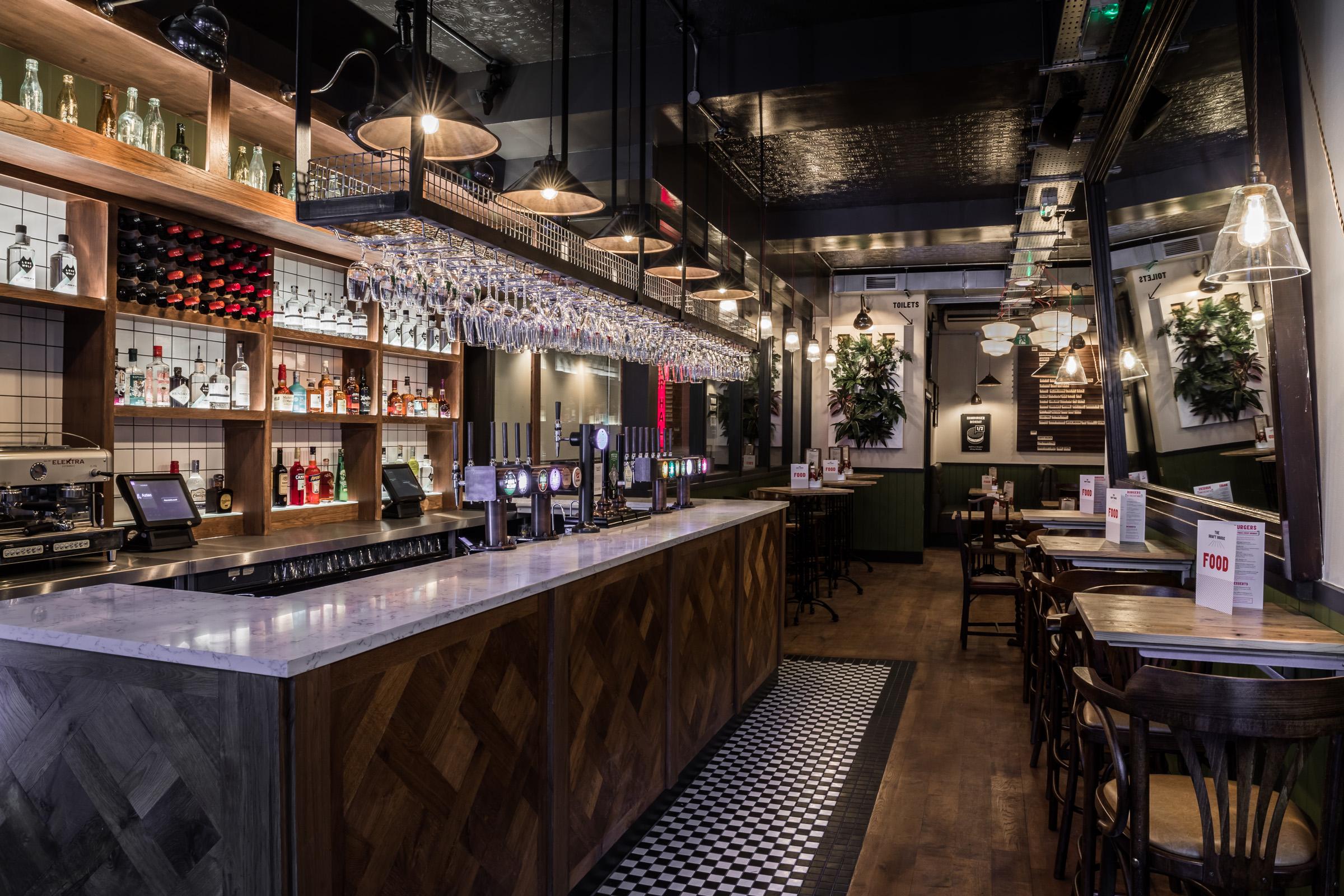 Stylish bar area at Draft House Farringdon, ideal for networking events and gatherings.
