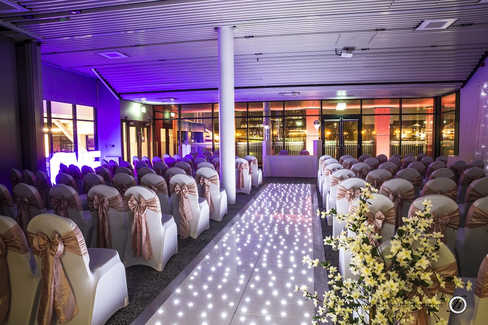 Elegant event space at Pier Eight Room, adorned chairs for weddings and formal gatherings.