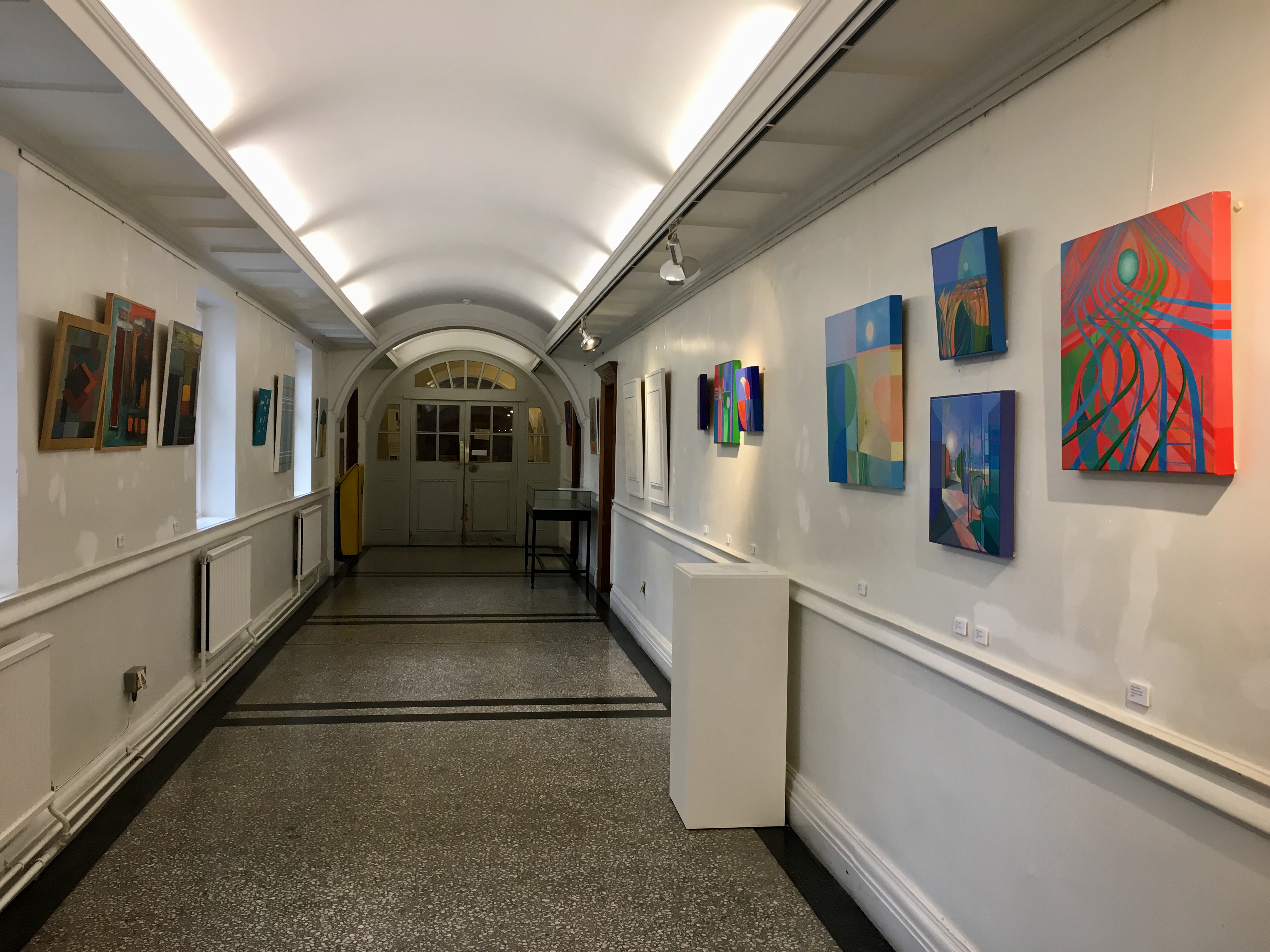Chelsea Gallery corridor with colorful art, perfect for networking events and exhibitions.