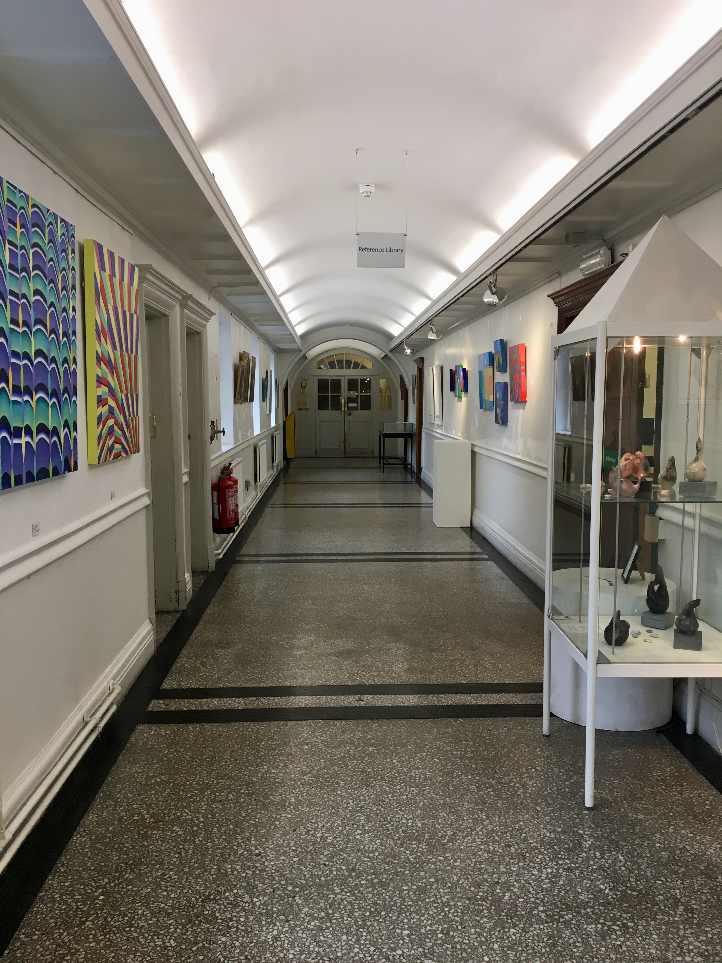 Chelsea Gallery corridor with vibrant artwork, ideal for networking events and art showcases.