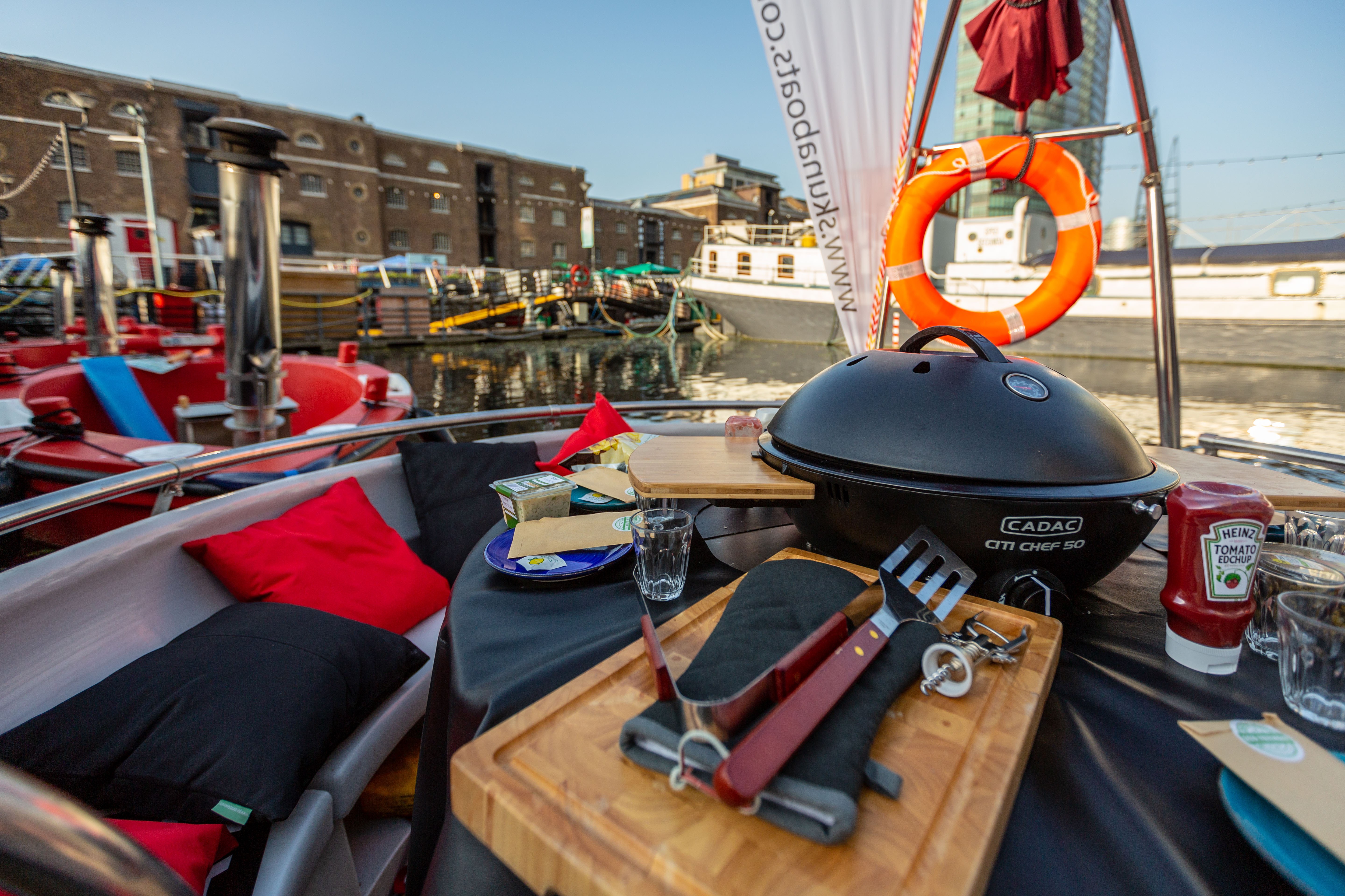 BBQ Boat with grill and vibrant seating for outdoor networking events.