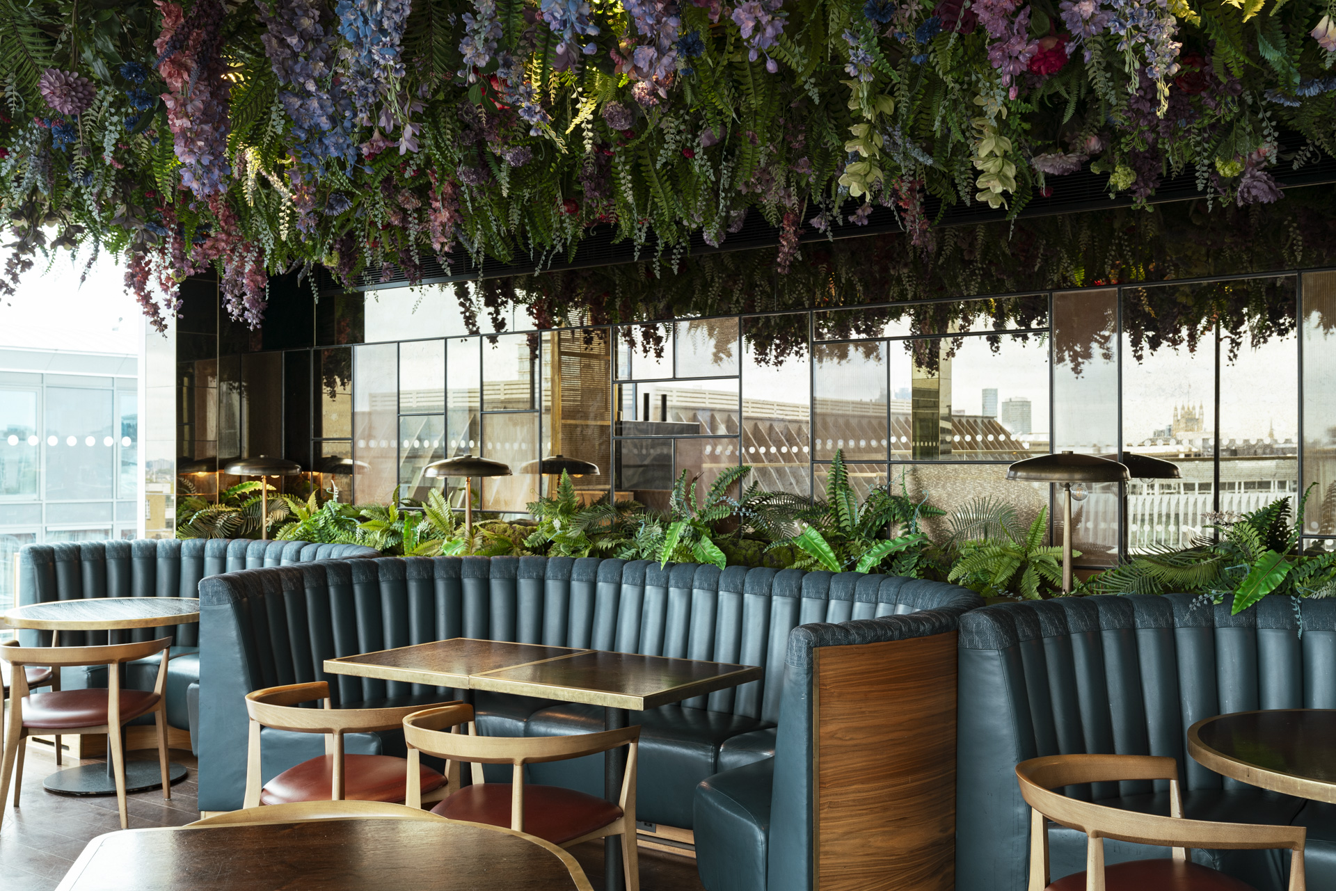 Stylish LSQ Rooftop venue with greenery, ideal for networking and social events.