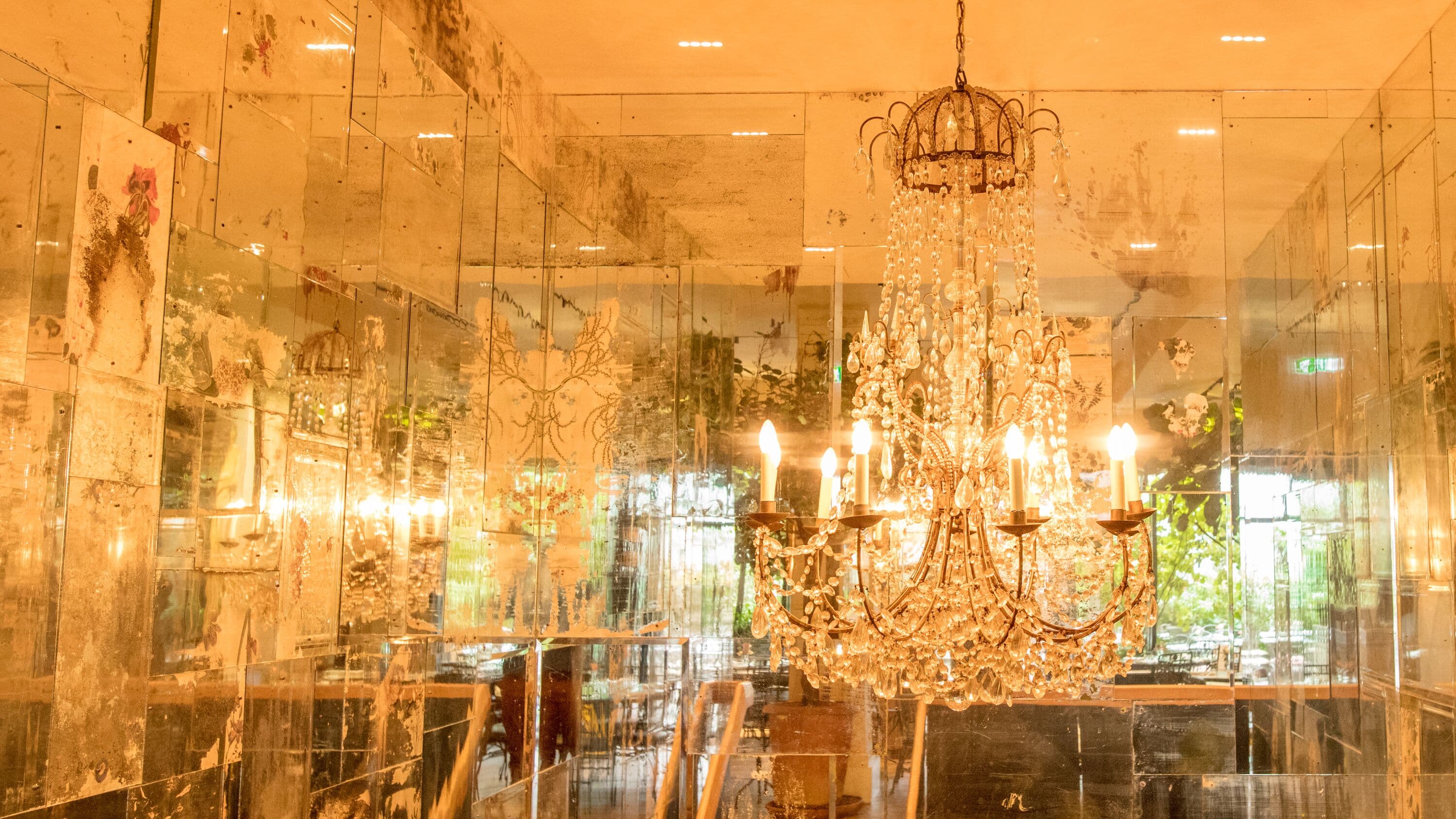 Elegant venue at Petersham Nurseries with chandelier, perfect for upscale events.