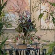 Floral centerpiece at La Goccia, Petersham Nurseries for elegant event decor.