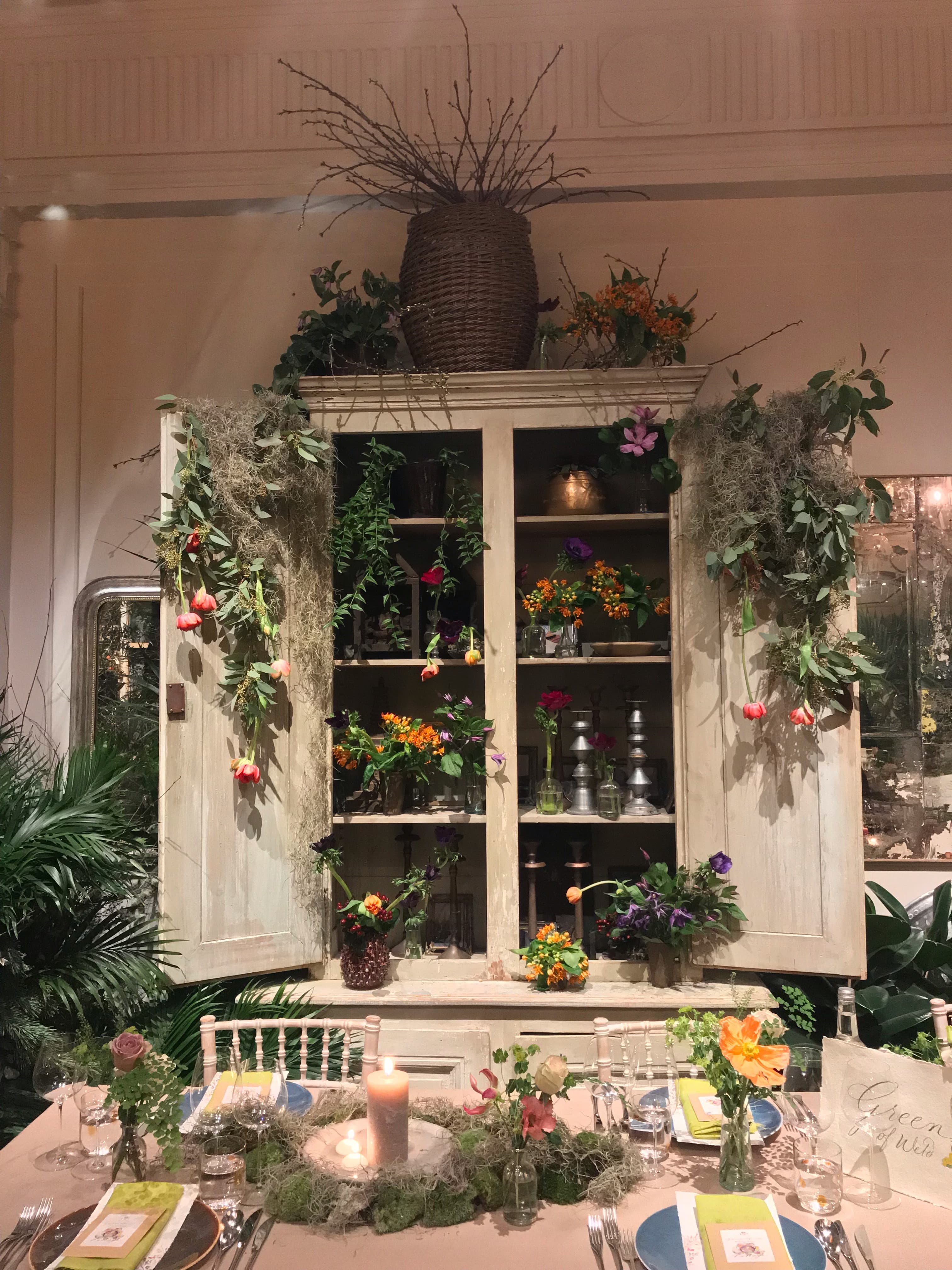 Lush floral display cabinet at Petersham Nurseries for events and gatherings.