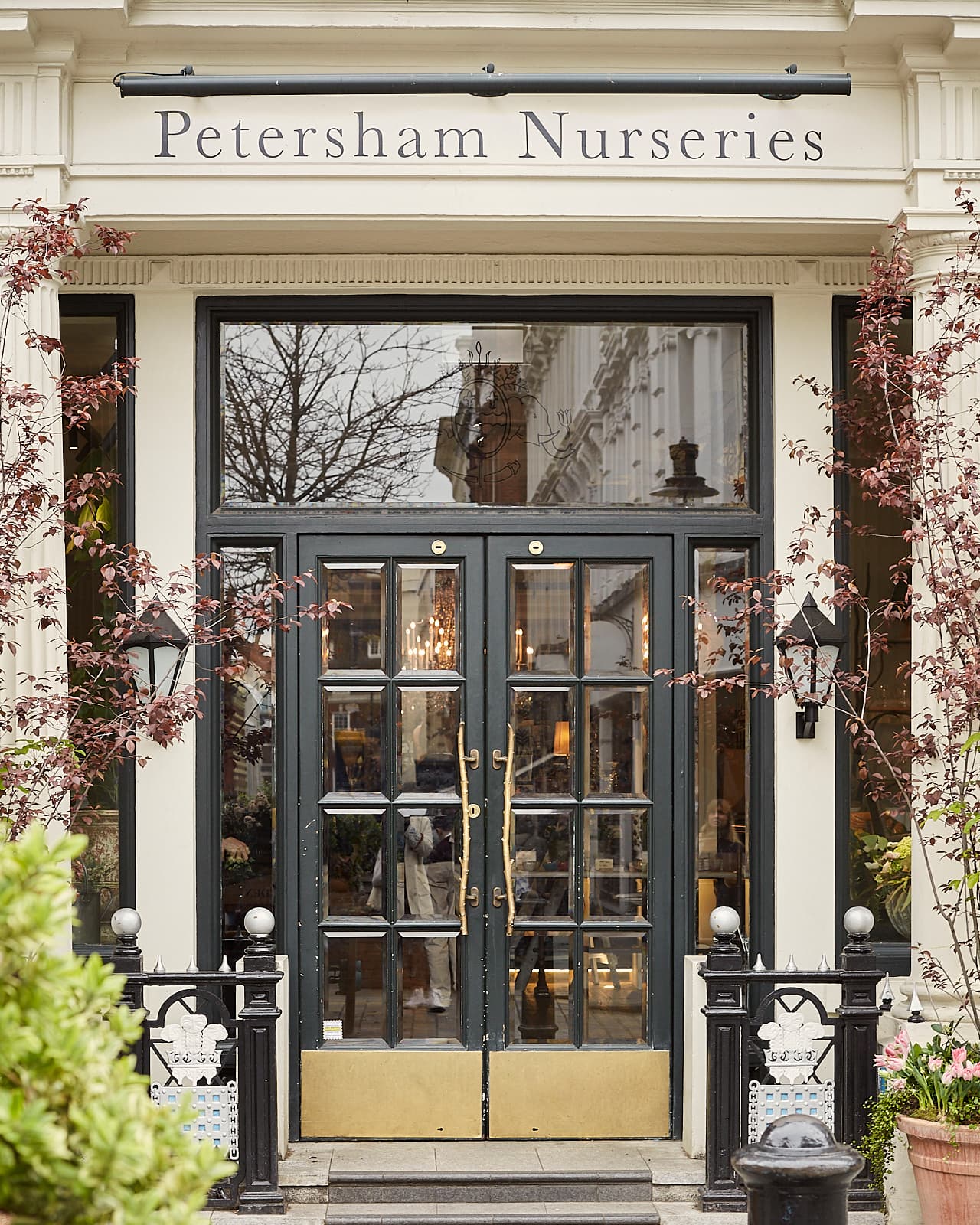 Elegant entrance of The Shop at Petersham Nurseries, perfect for corporate events.