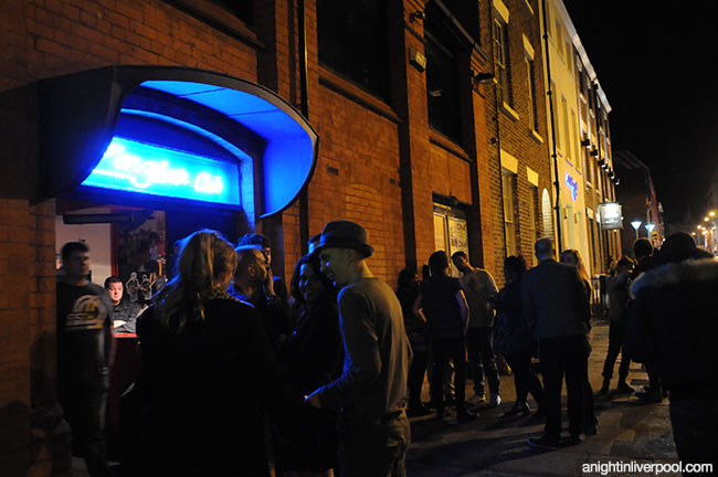 Vibrant nightlife at The Zanzibar Club with lively crowd and illuminated signage.