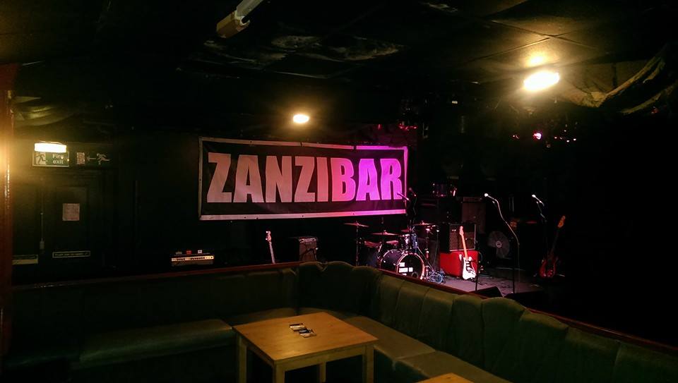 Intimate live music venue at The Zanzibar Club with stage and cozy seating for events.
