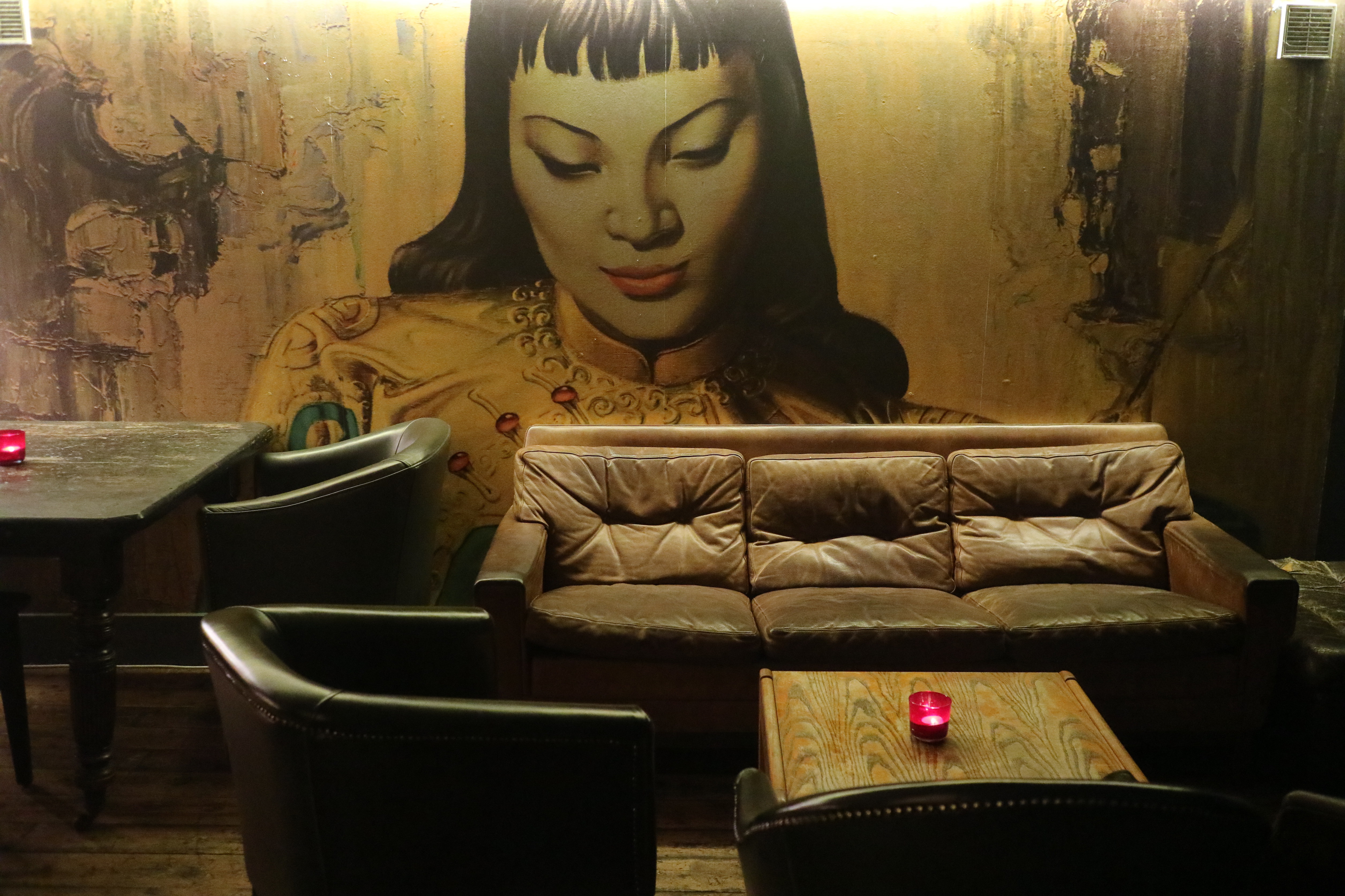 Stylish lounge with mural in The Regent Pub, perfect for networking or brainstorming events.