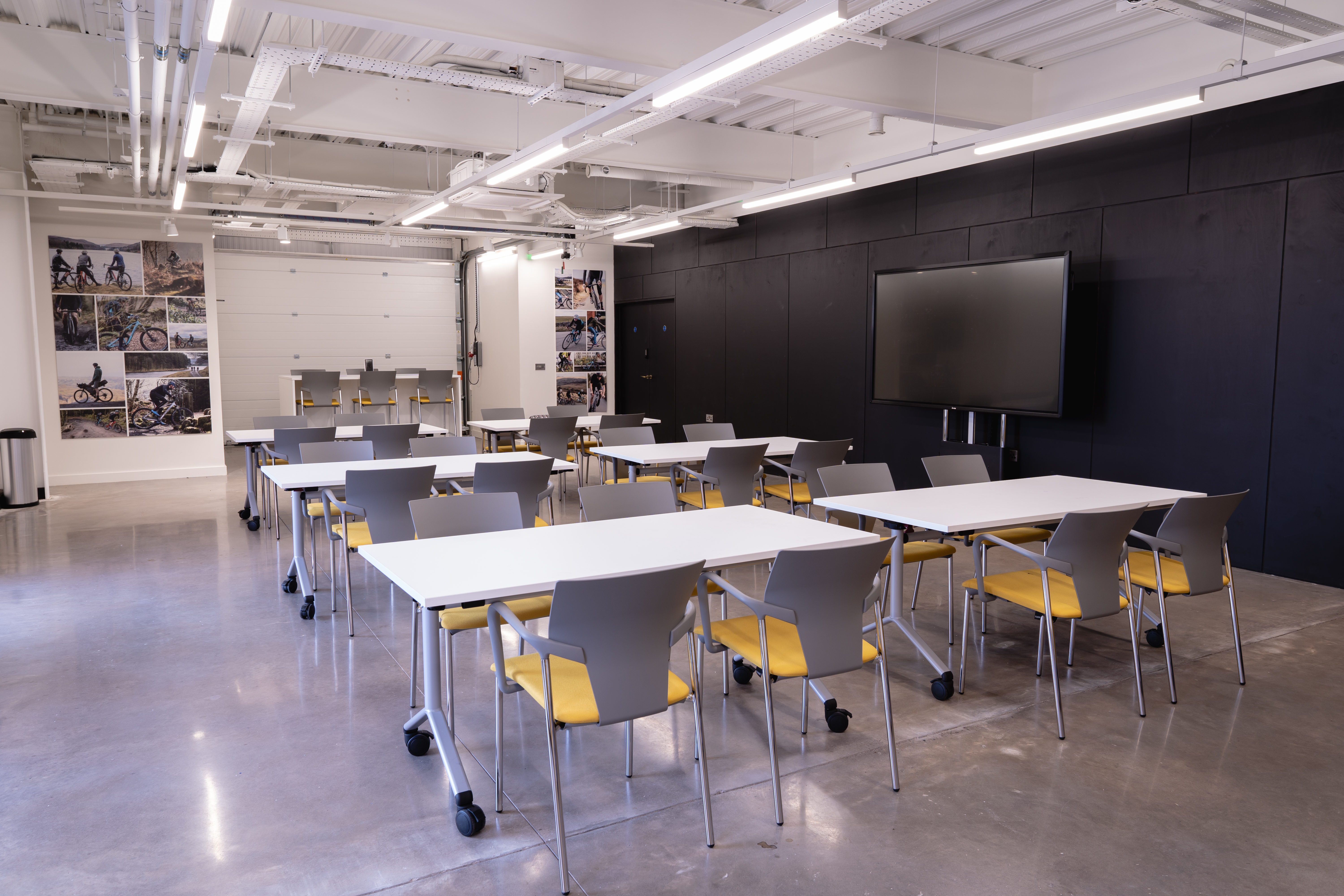 Versatile meeting space with modular tables for workshops at Boardman Performance Centre.