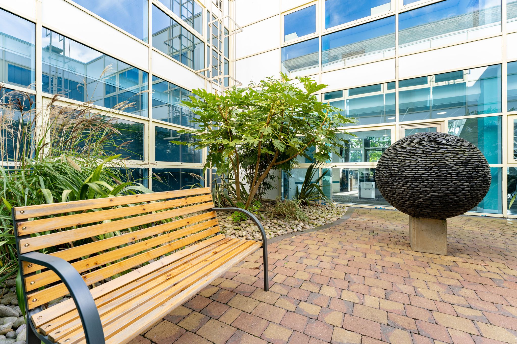Baskerville Suite outdoor space with greenery, ideal for events and networking.