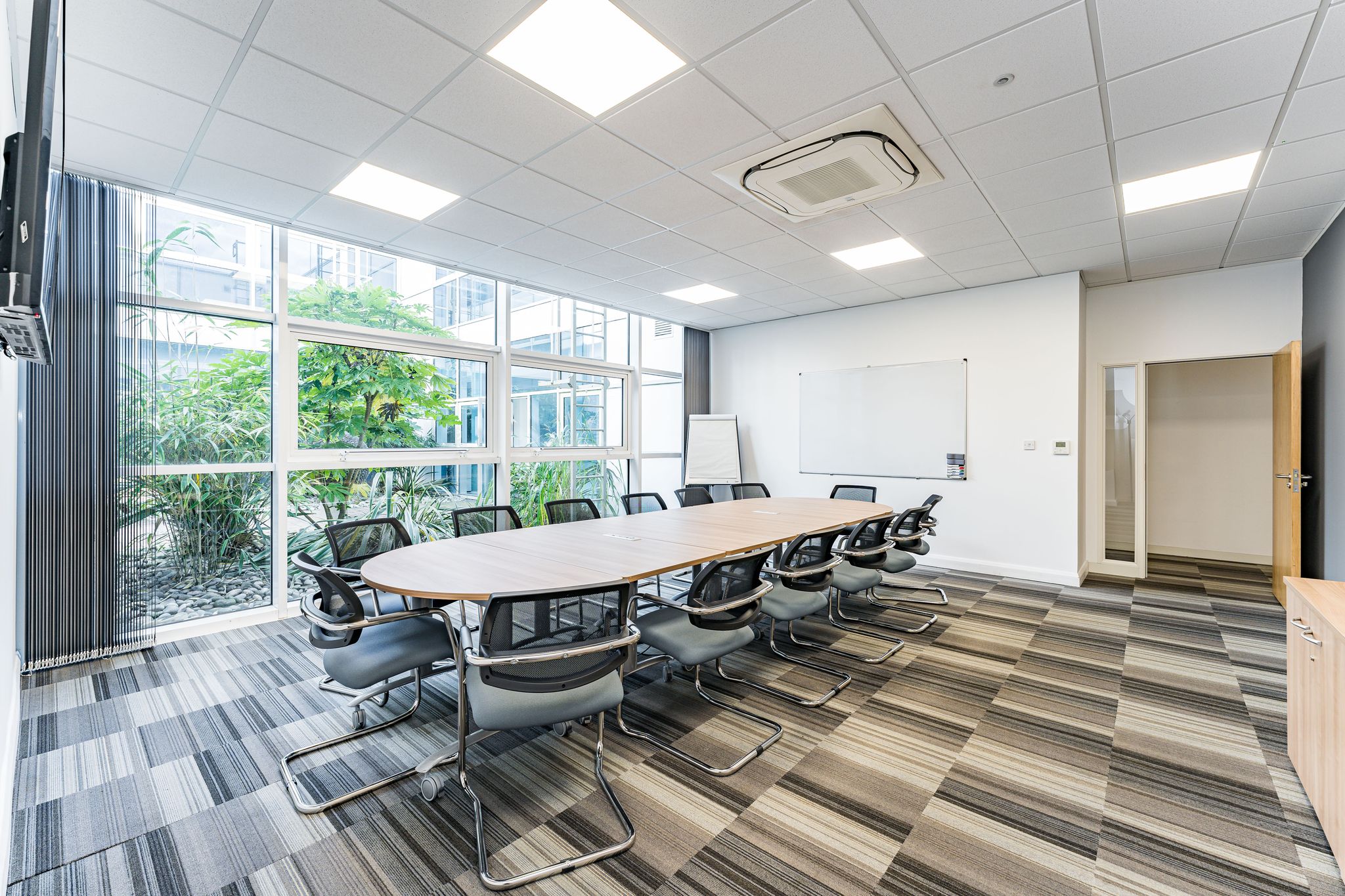 Modern conference room in Baskerville Suite, UBC Birmingham for meetings and presentations.