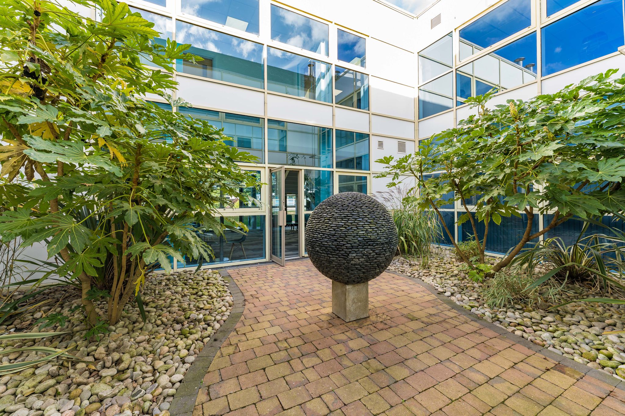 Arkwright Suite outdoor space with sculpture, ideal for networking events in Birmingham.