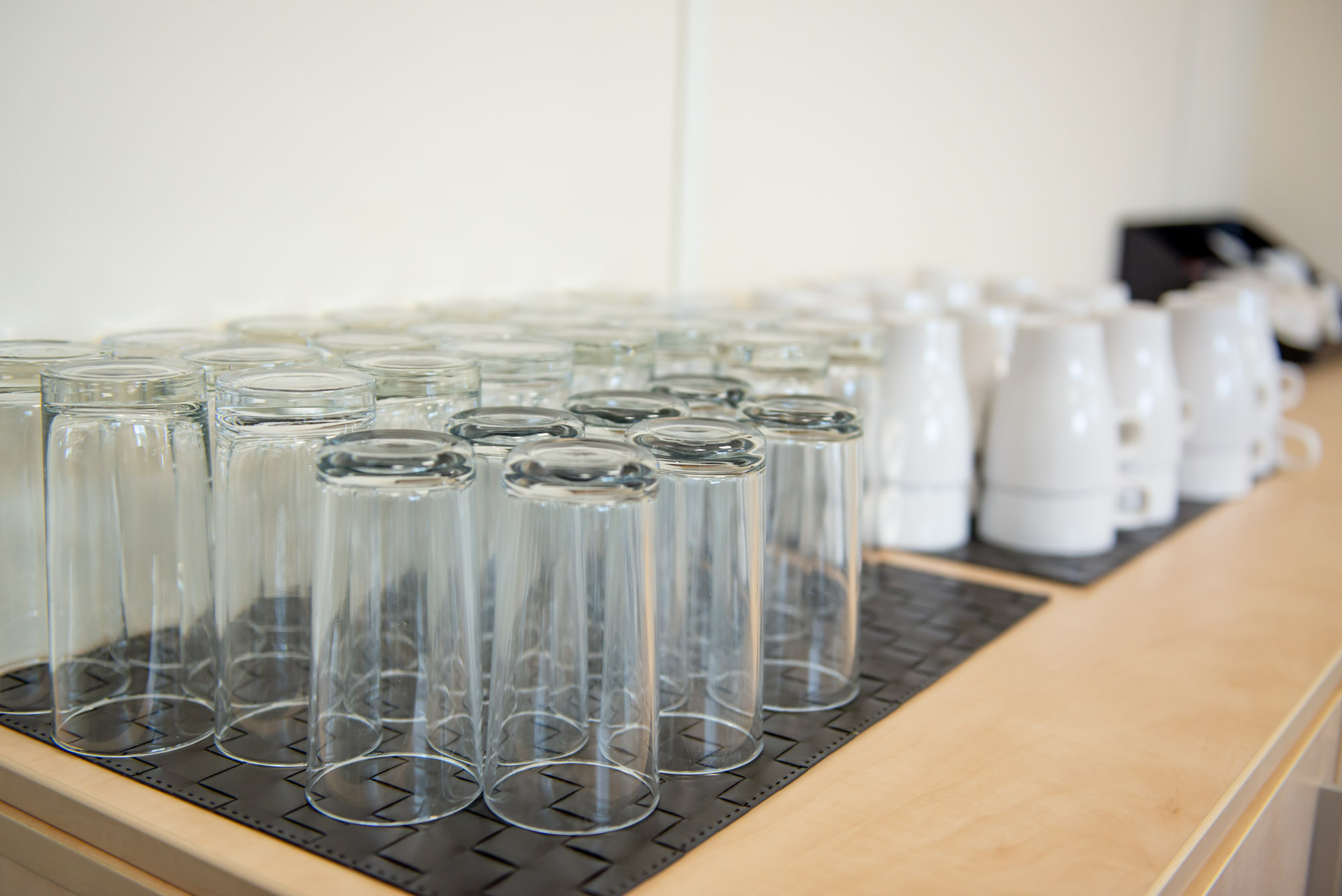 De Montford Suite setup with glassware for a professional meeting or event.