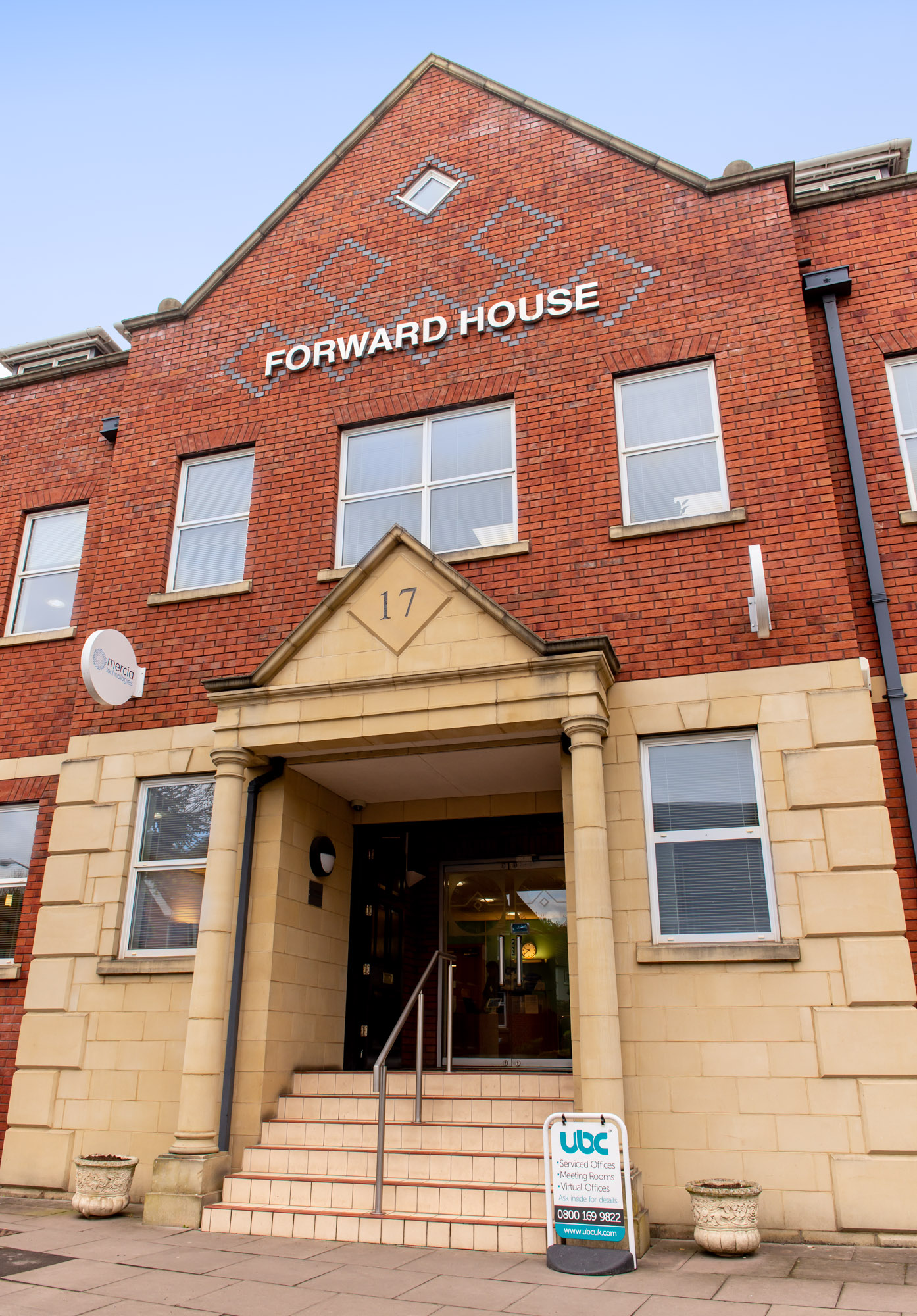 De Montford Suite entrance, brick and stone architecture, ideal for corporate events.