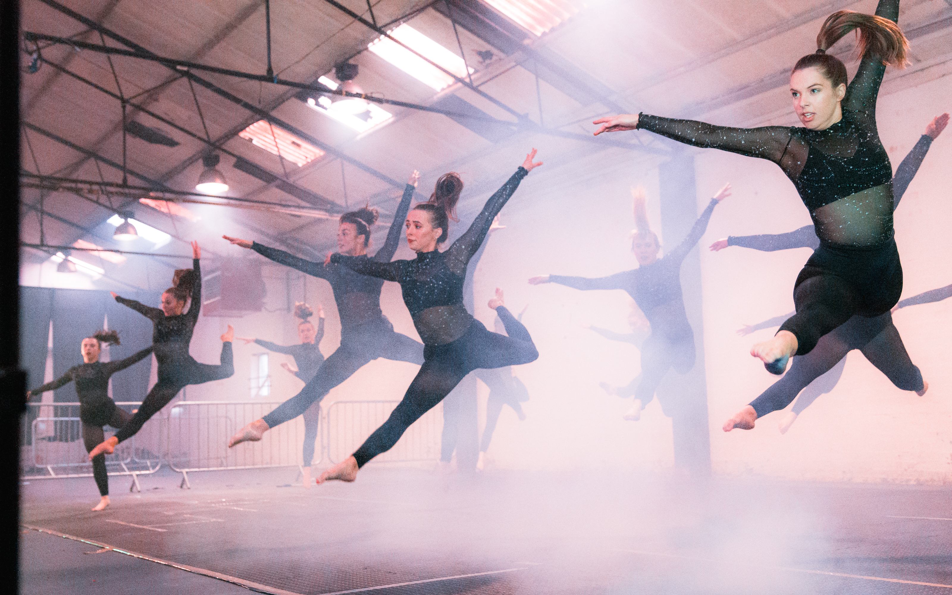 Dynamic dancers mid-air at SS1, Secret Space Digbeth - engaging event entertainment.
